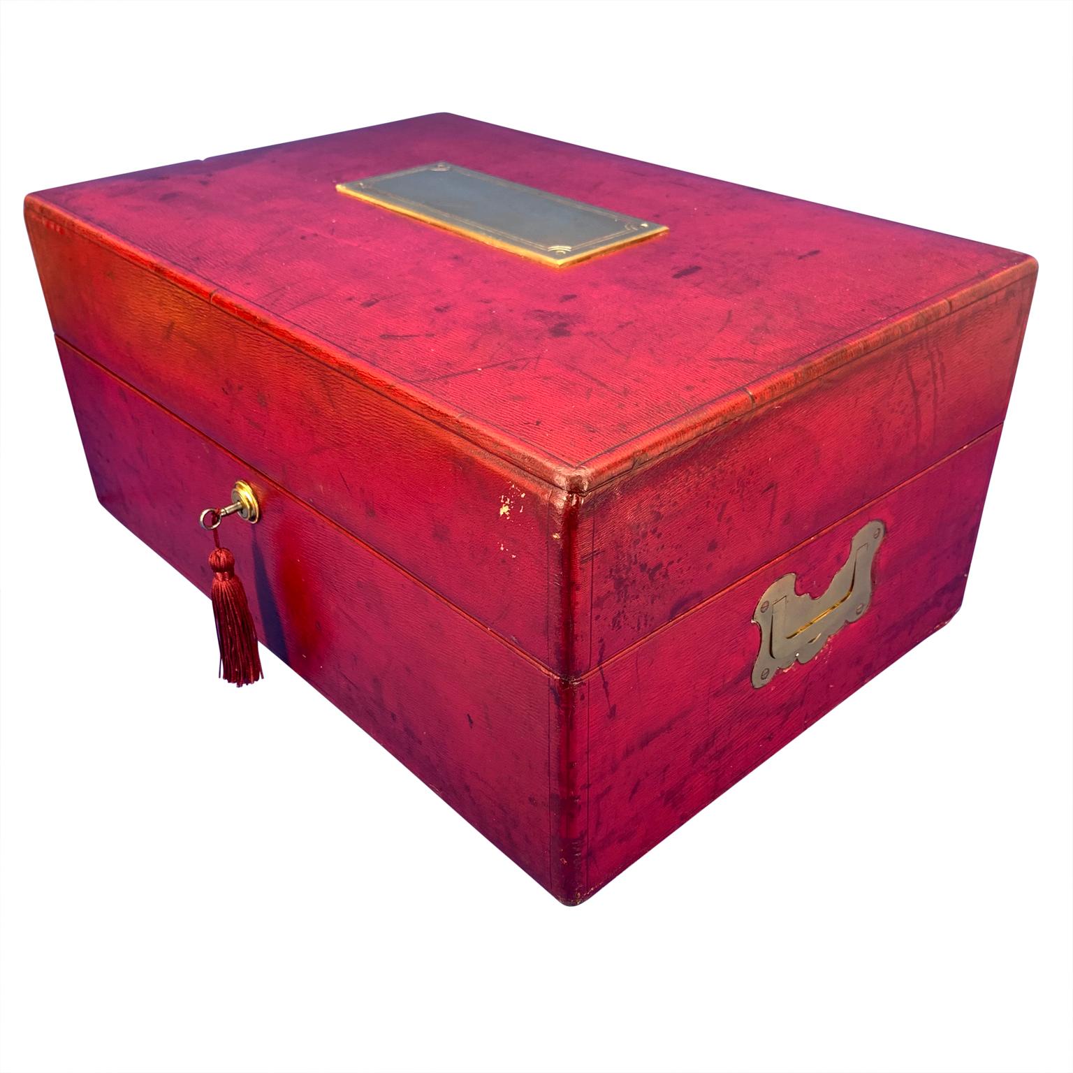 Large Red Moroccan leather document box. Handmade by British craftsman W. Leuchars & Son, London, Circa 1850.
This large red, grained Moroccan leather document strong box with a vacant brass presentation plate and inset brass side handles is