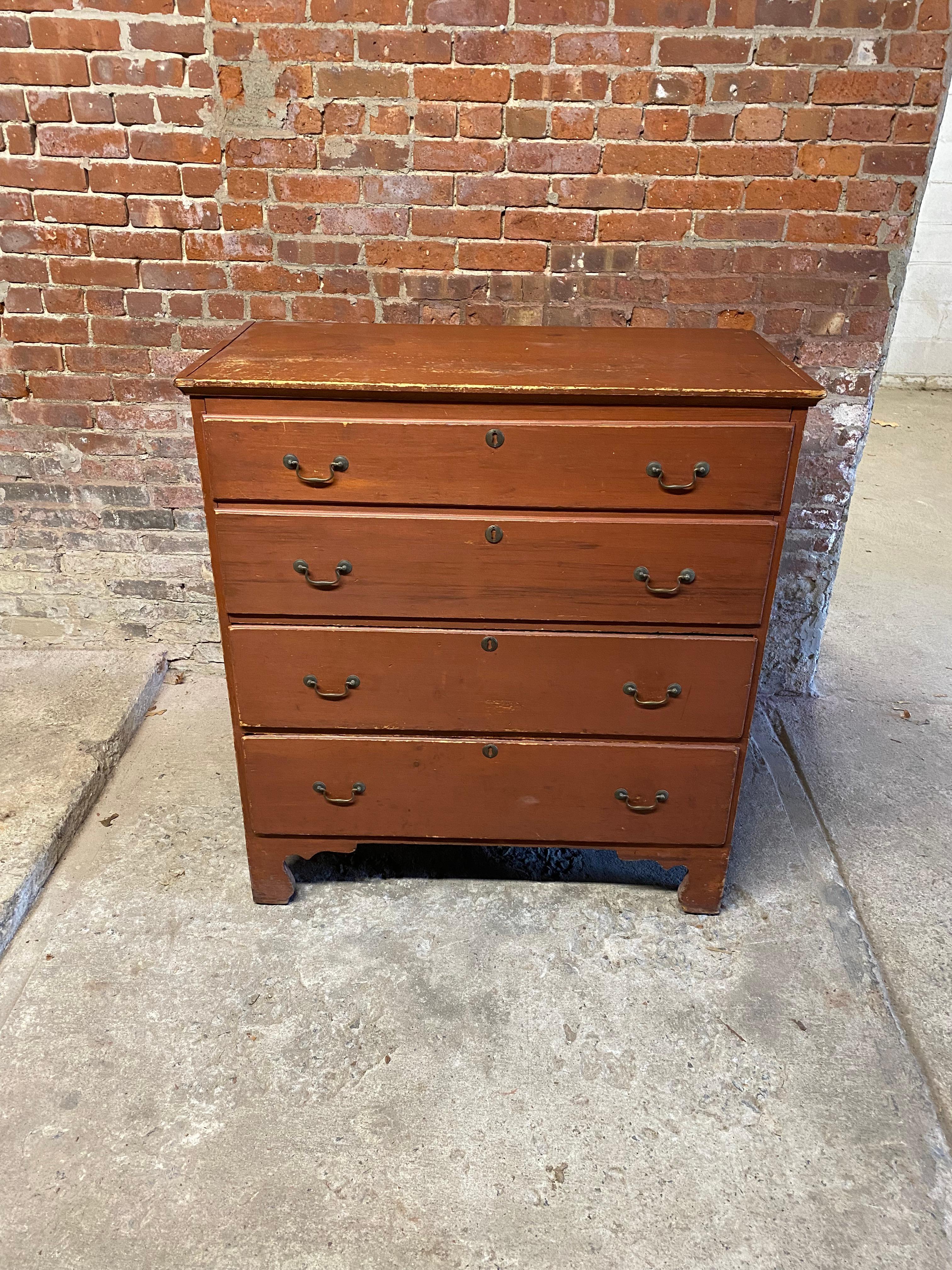 Fabulous two drawer knotty pine blanket chest. Impressive single board top and two board back. Normally a good rule of thumb is the larger the board width the older the piece. Featured are the original brasses, lyrical carved bracket feet and base,
