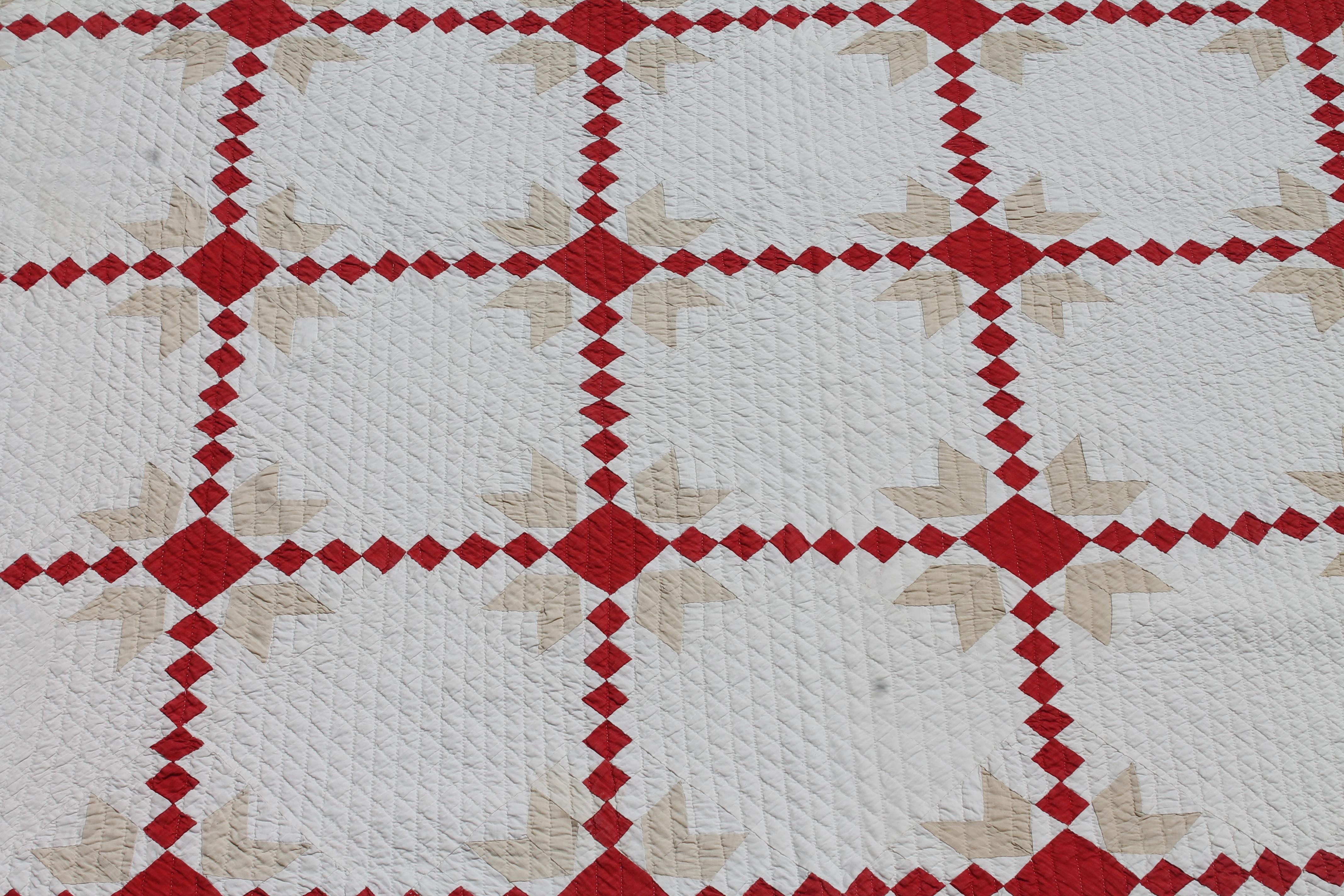 This finely quilted and pieced postage stamp chain quilt is in fine condition. It is crisp condition with a slight light fade overall. It has a original brass clip from the collectors that owned it. Condition is very good.