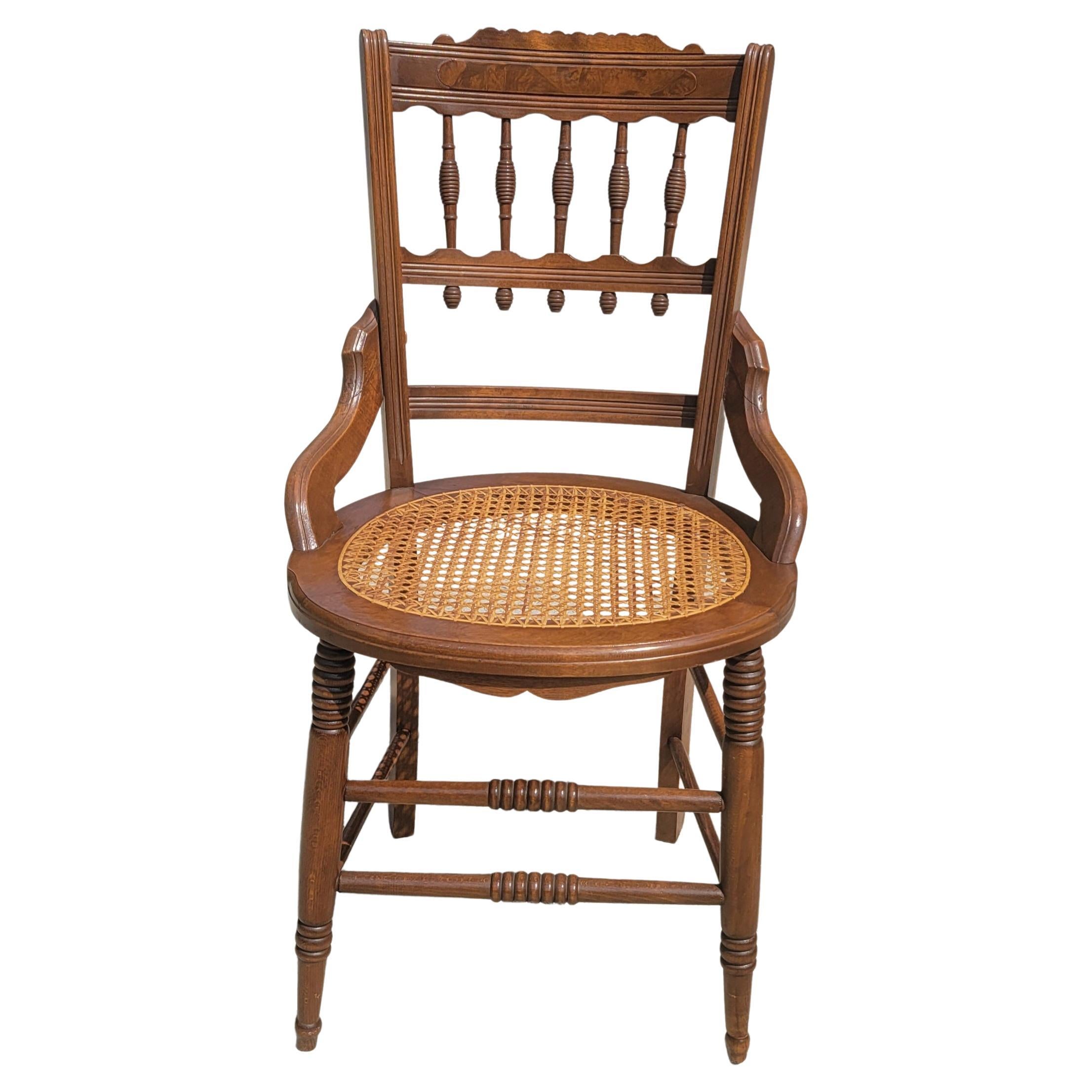 A gorgeous pair of Eastlake Victorian period carved walnut with cane seat chairs. Recently refinished and recaned. Will sparkle any room in your home. Use them as additional chairs in your dining room or kitchen.