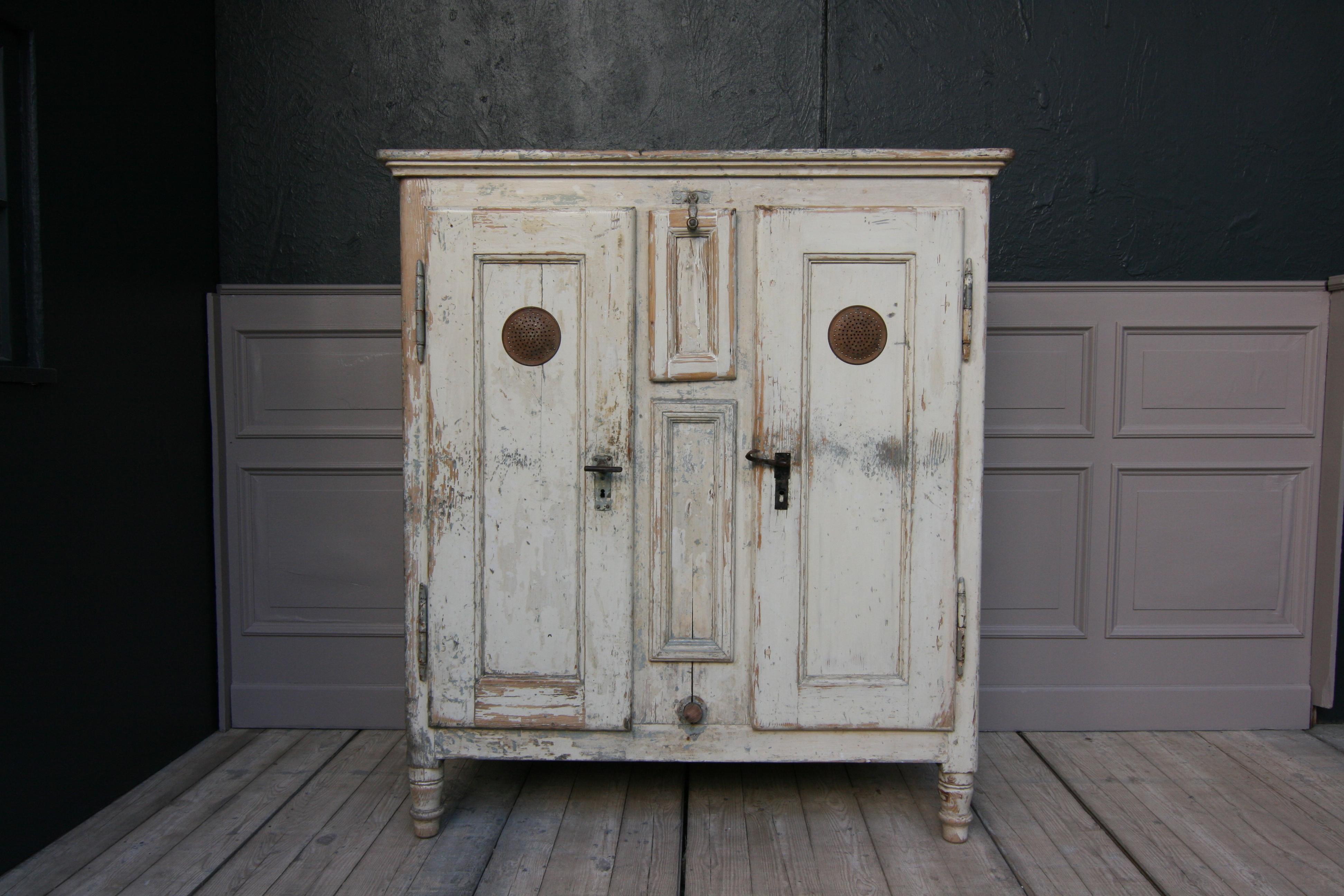 Antique refrigerator or icebox from circa 1870, in original painting, restored ready to live (newer paint layer removed, completely sanded and transparently sealed; inside completely new painted white, old ice bucket installation removed and 4 new
