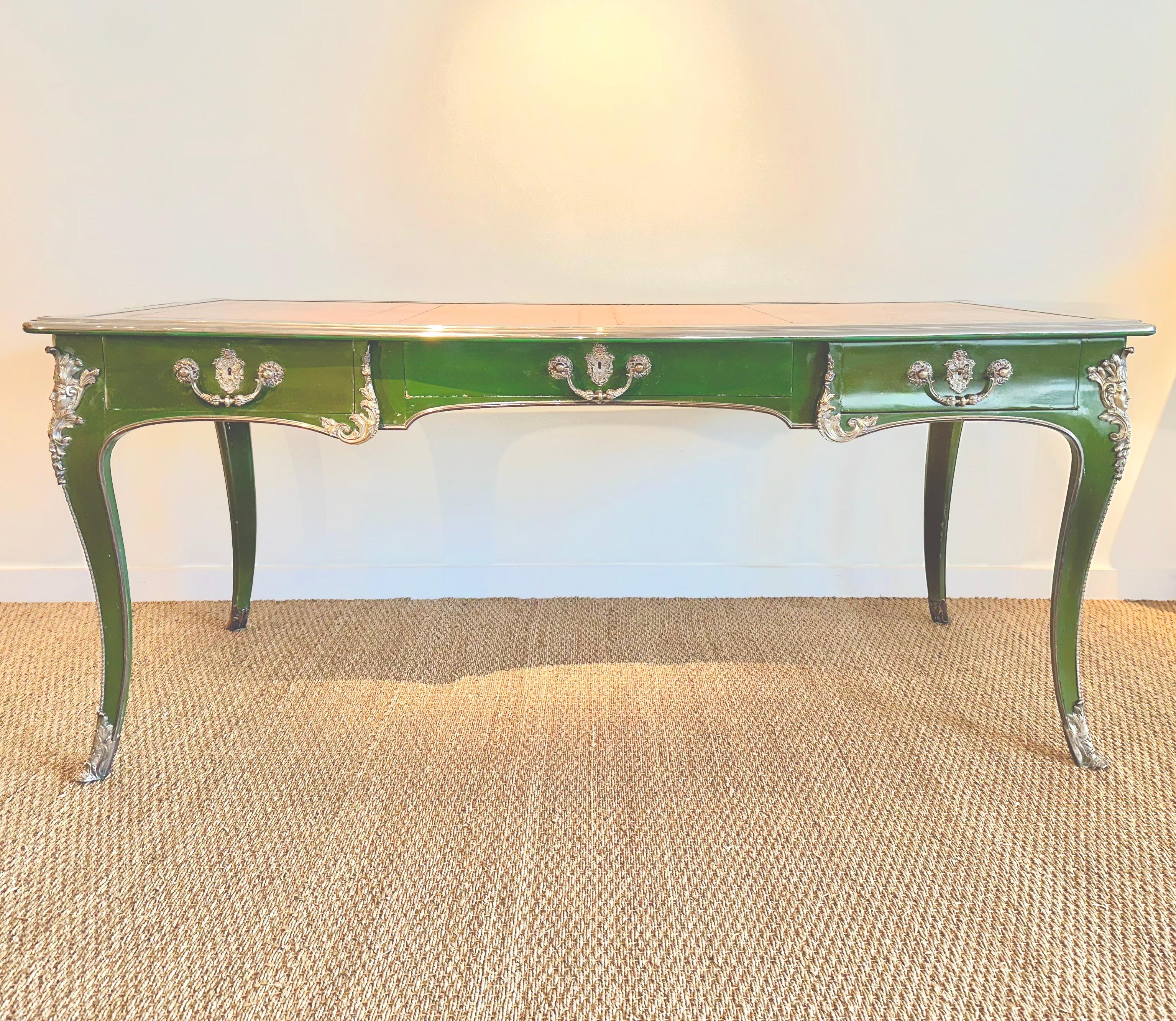 Rare French 19th century Régence style unuasual Green lacquer Bureau Plat, very rare Silvered mounts. Raised mounted cabriole legs, the scalloped shaped frieze with three drawers each with an ormolu escutcheon, the rear and sides finished in a