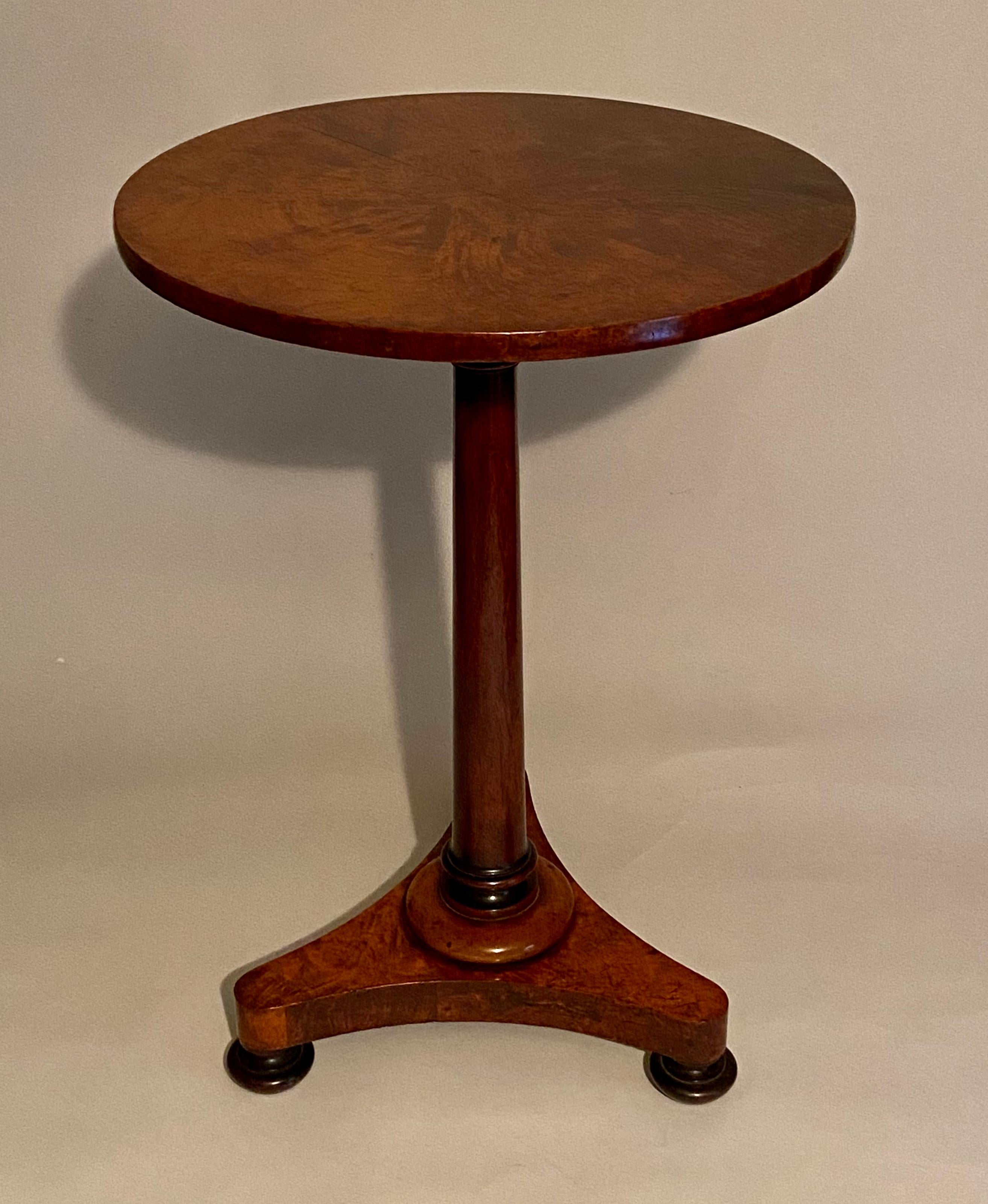 Regency Amboyna and Padouk wine table with circular top and tri-form base.