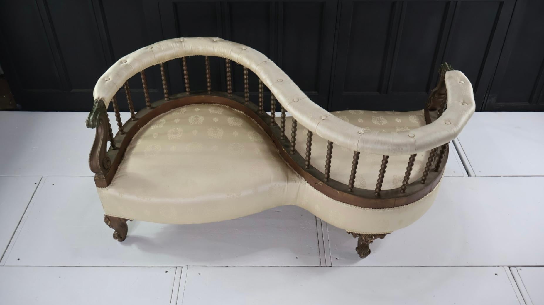 A very clean example of a 19th century English, Regency, conversation/love seat.
The seat has been professionally reupholstered in period style fabric, with a button back finish to the arm rests, and has been re webbed and re sprung.
The frame is in