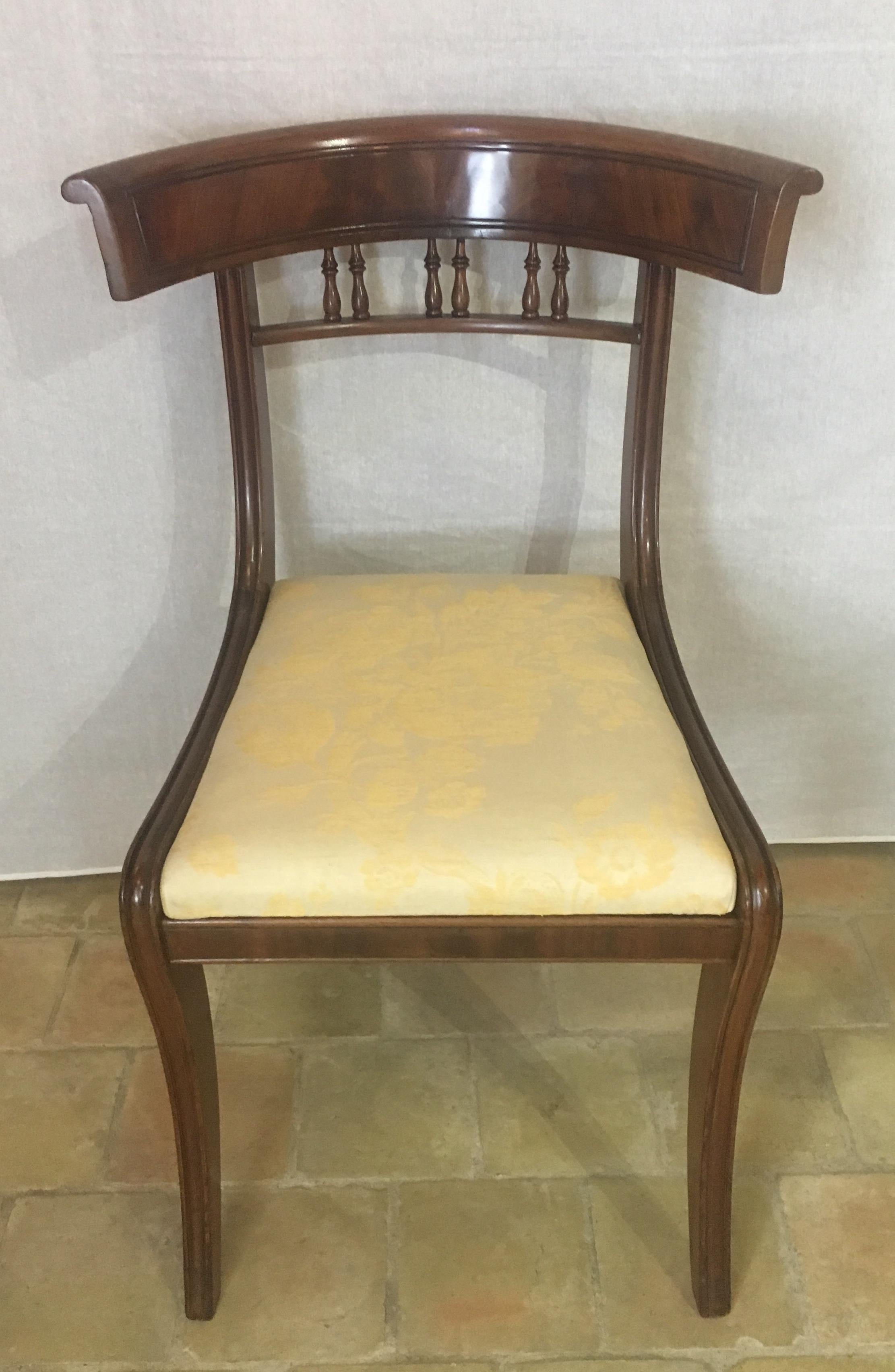 Set of 6 English-made Regency dining chairs that have been masterfully handcrafted in beautiful solid mahogany and accentuated curved back in flame mahogany. The wood is from Cuba. The finish and attention to detail are truly breathtaking. 

The