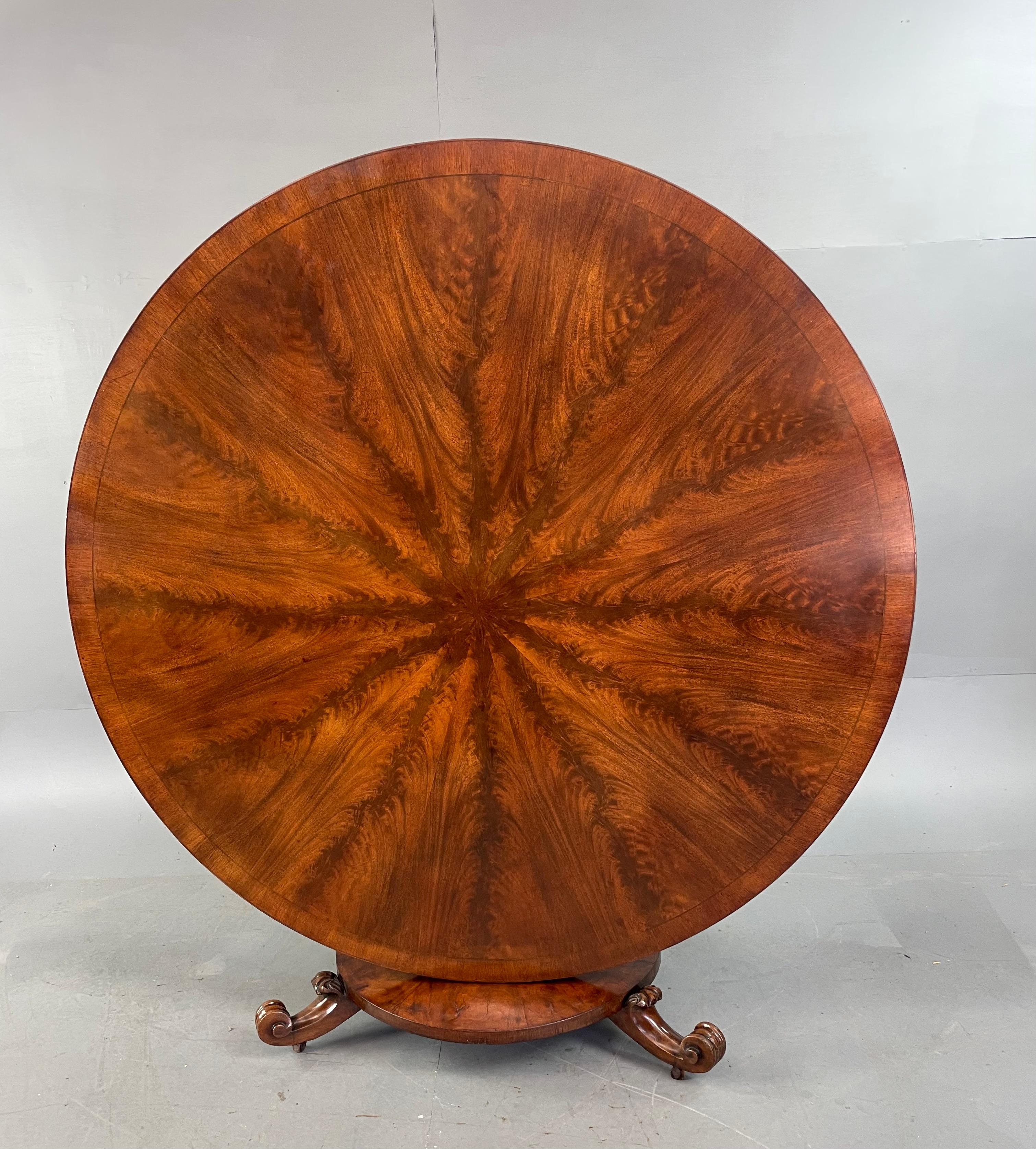 Fine quality large late Regency radial flame mahogany round dining table / centre table ,147 cm diameter 
The table will seat six comfortably eight at a squeeze .
It has a great colour and superb flame mahogany grain ,The table is in very good