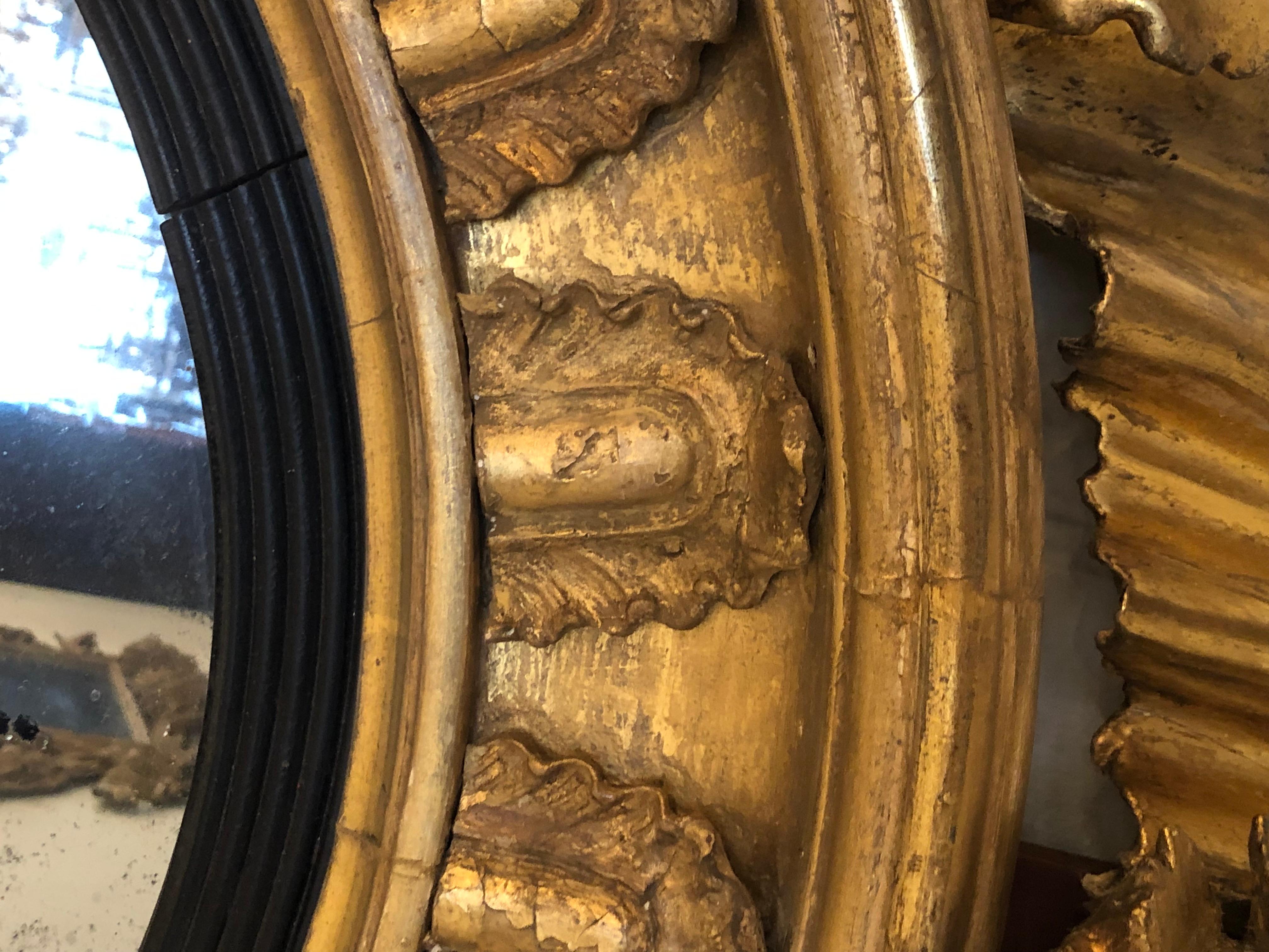 Gesso 19th Century Regency Gilt and Ebonized Convex Mirror For Sale