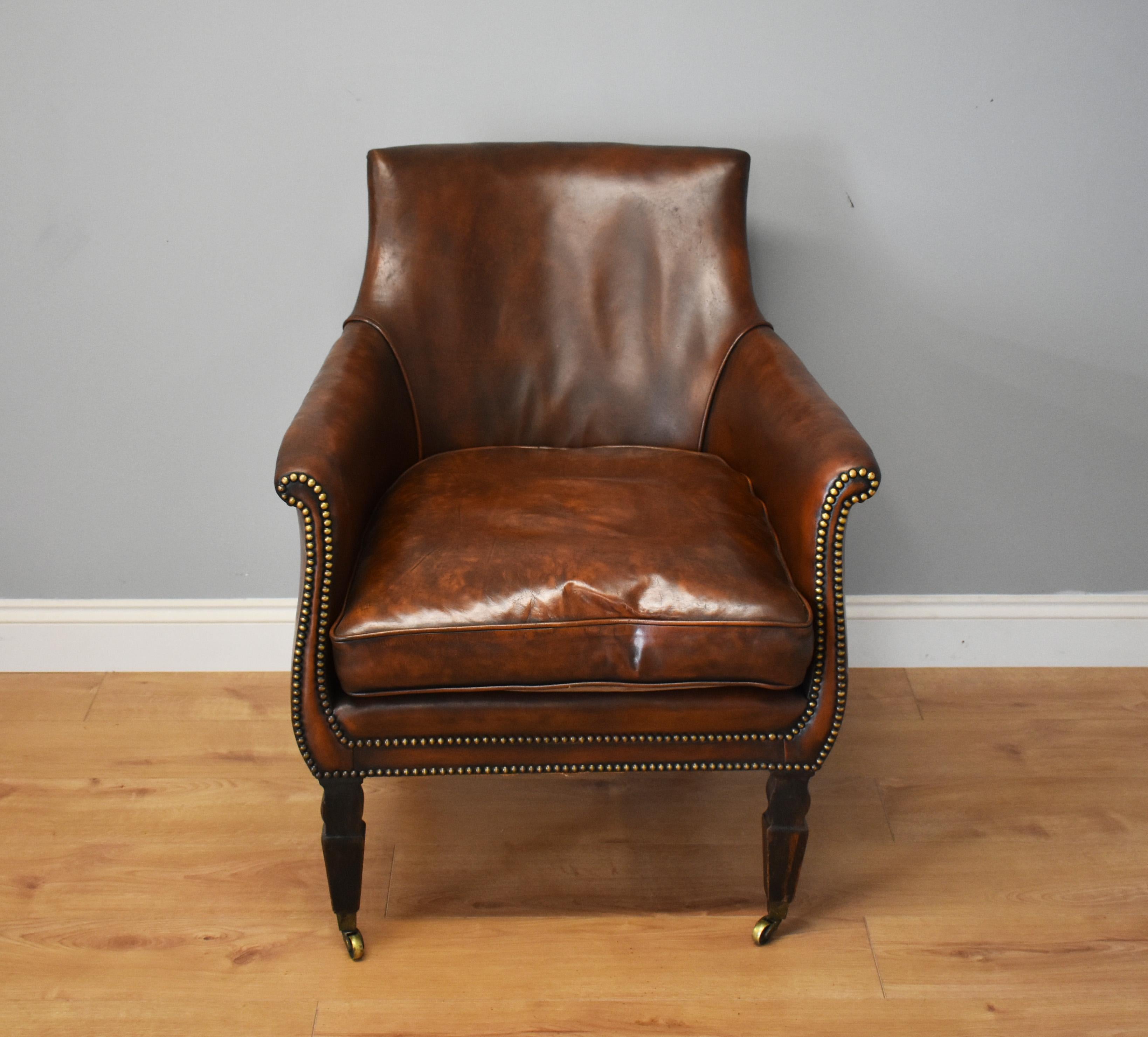 For sale is this fine quality 19th century Regency leather library chair which has been upholstered in hand dyed leather, with a feather stuffed cushion, in very good condition. 

Measures: Width 28