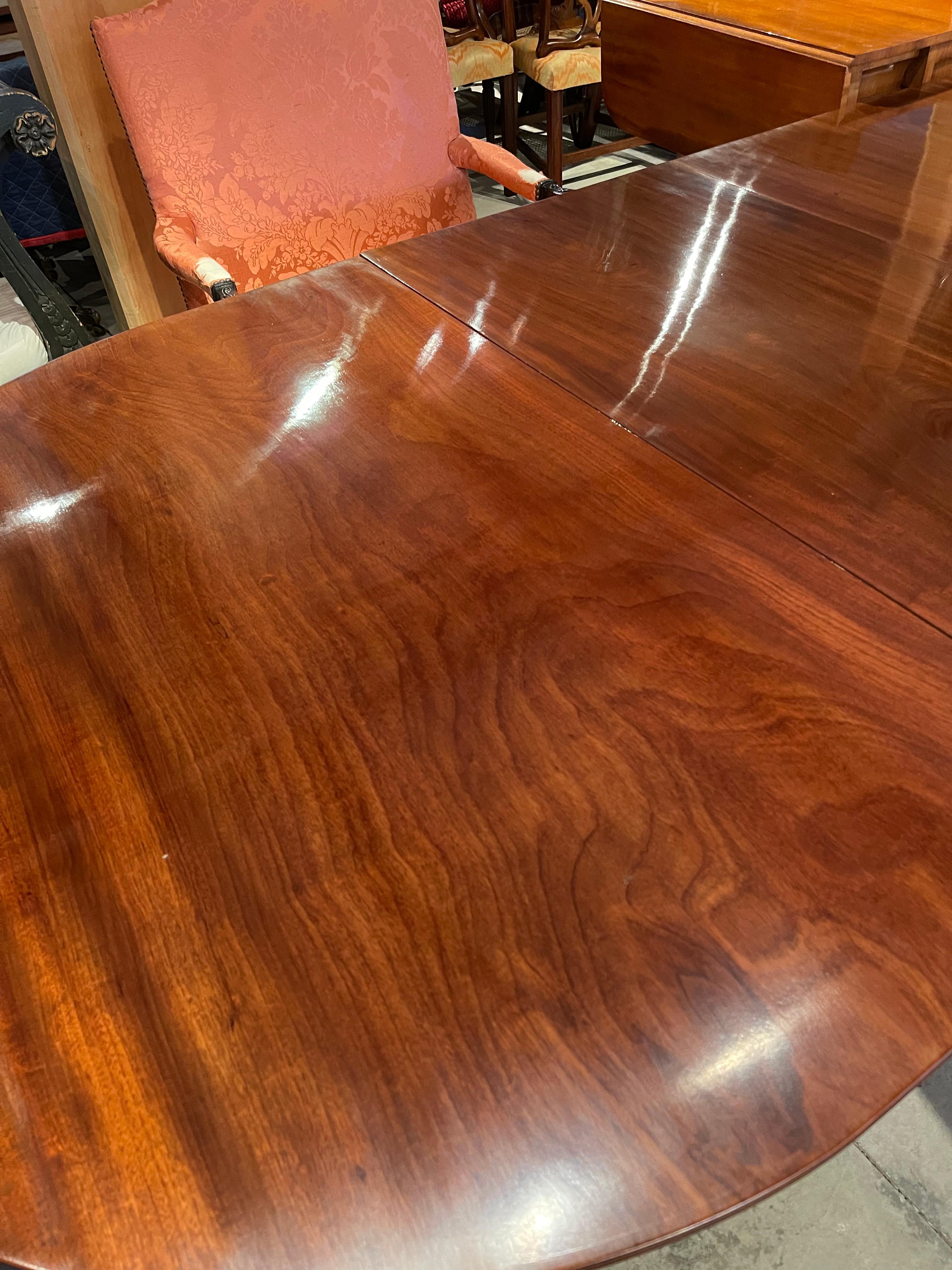 Early 19th century Regency Mahogany four pedestal dining table. Solid Mahogany Boards with well-figured early grain from old growth trees. Large board tops. Leaves original to table. 

--Photographs show table in full length and without