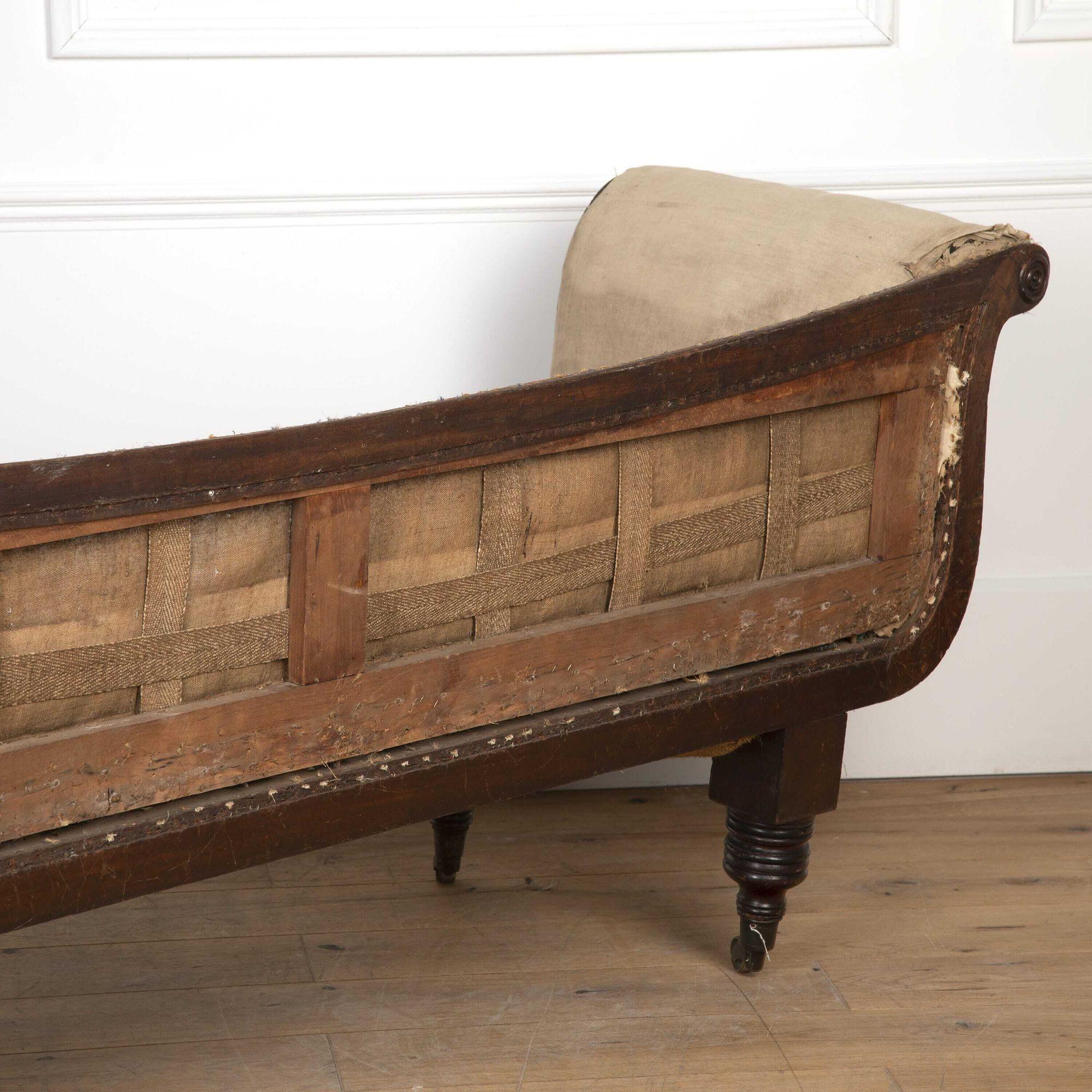 Superb Regency mahogany sofa in the Regency style.
With shapely scroll arms that terminate in roundels on both ends. This sofa also features a shaped back which is also finished on the reverse to make it available for freestanding.
Raised on