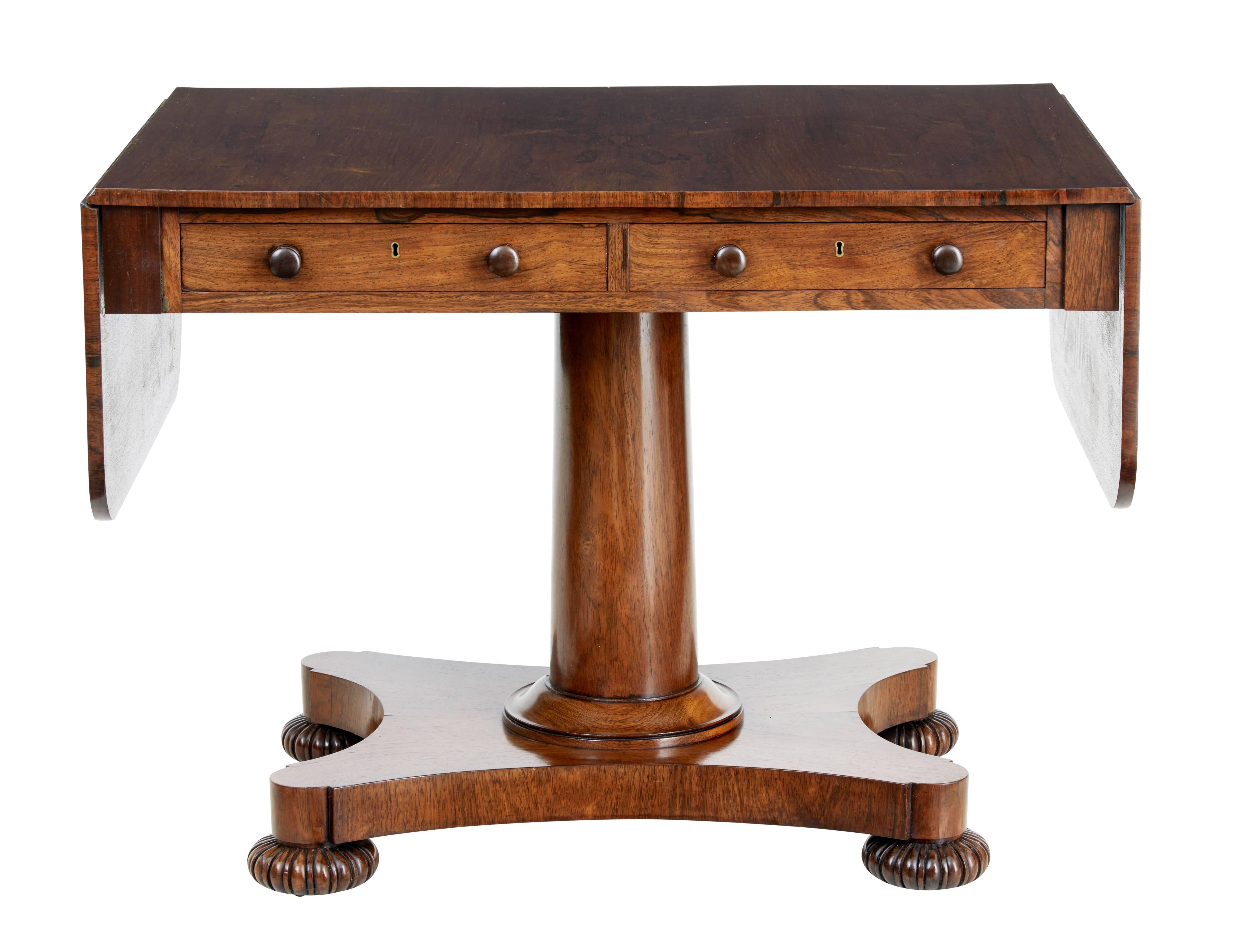Fine quality Regency period sofa table, circa 1820.

We are pleased to showcase this sofa table of ideal proportions.

Stunning Palisander veneers. Two drawers to the front.

Standing on stem and quadriform base, shaped bun feet and original