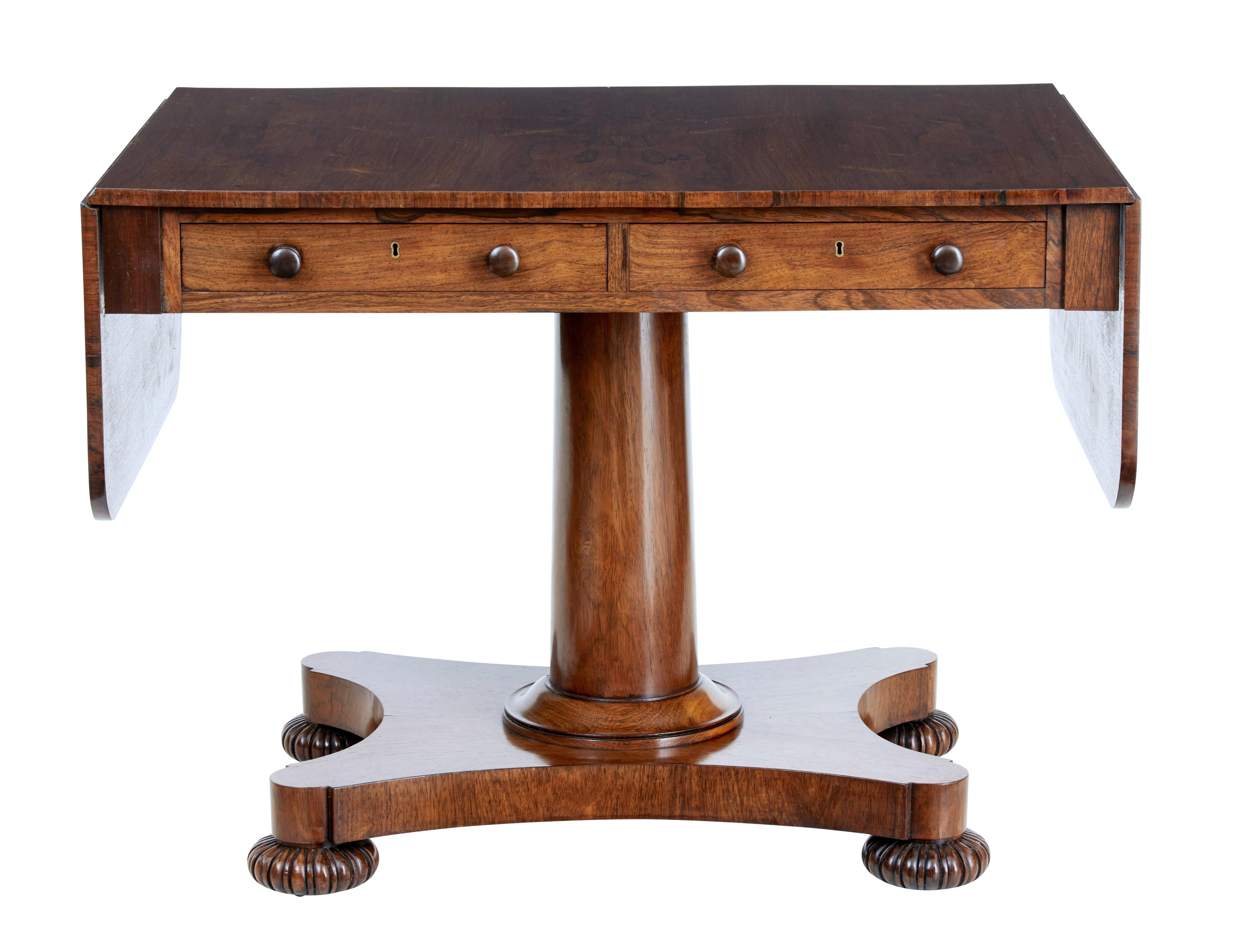Fine quality regency period sofa table, circa 1820.

We are pleased to showcase this sofa table of ideal proportions.

Stunning rosewood veneers. 2 drawers to the front.

Standing on stem and quadriform base, shaped bun feet and original