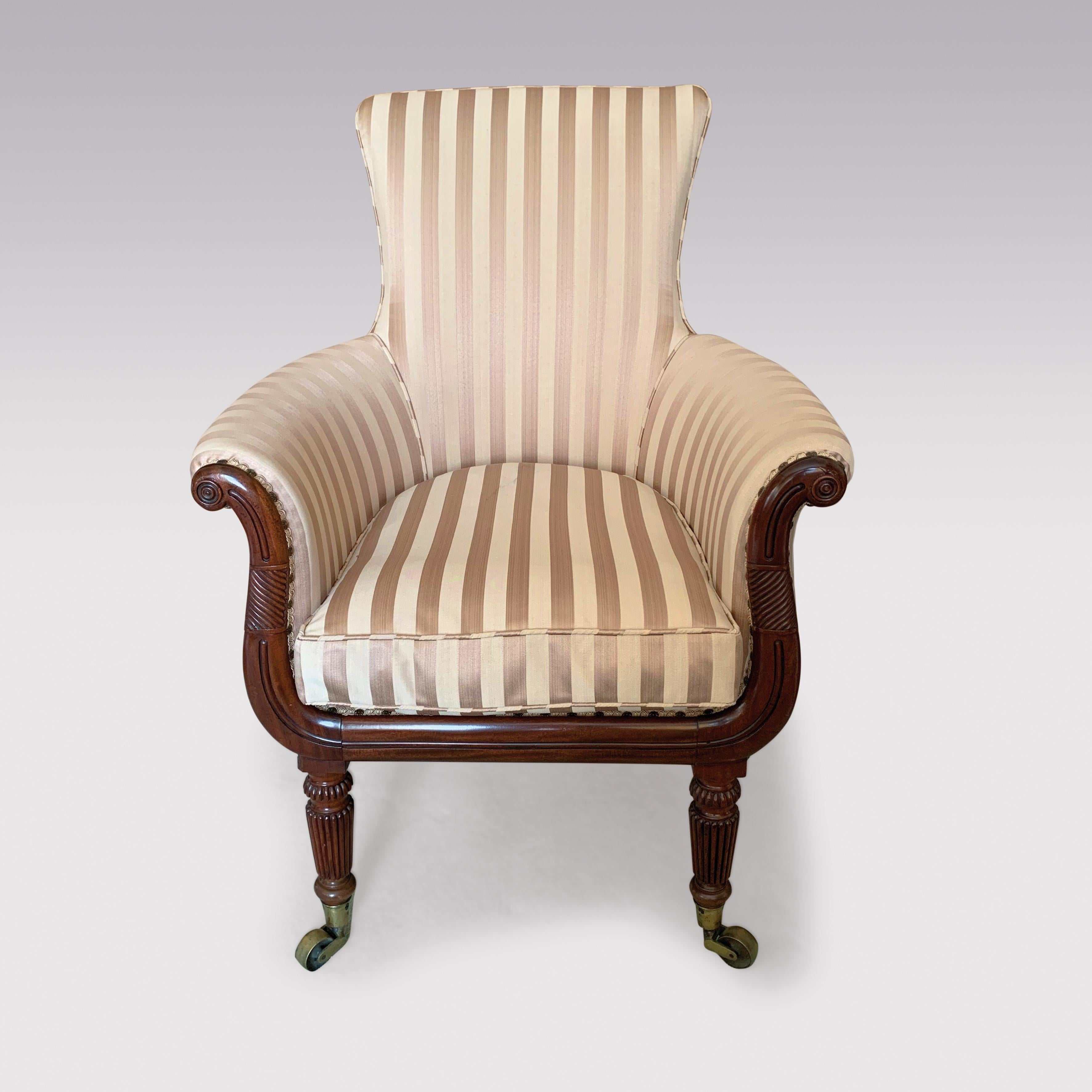 An early 19th century Regency period Tub chair in the style of Gillows of Lancaster, having spoon back with carved lyre-shaped arms, supported on turned reeded legs ending on brass castors.
