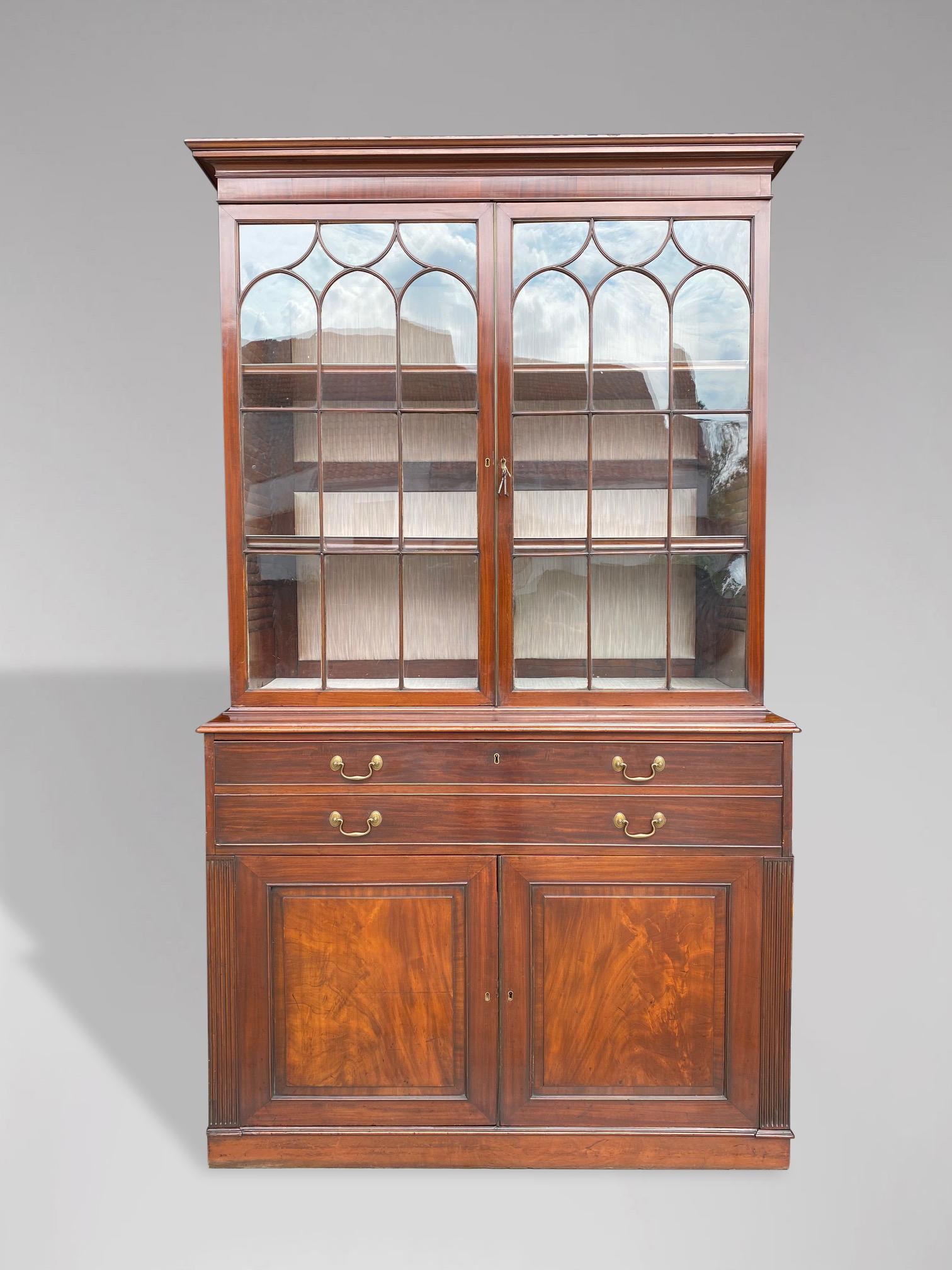 A stunning early 19th century, George III - Regency period solid mahogany secretaire bookcase. Well proportioned mahogany bookcase with astragal glazed 2-door cabinet over a fitted fall-front secretaire writing drawer with leather inset to top,