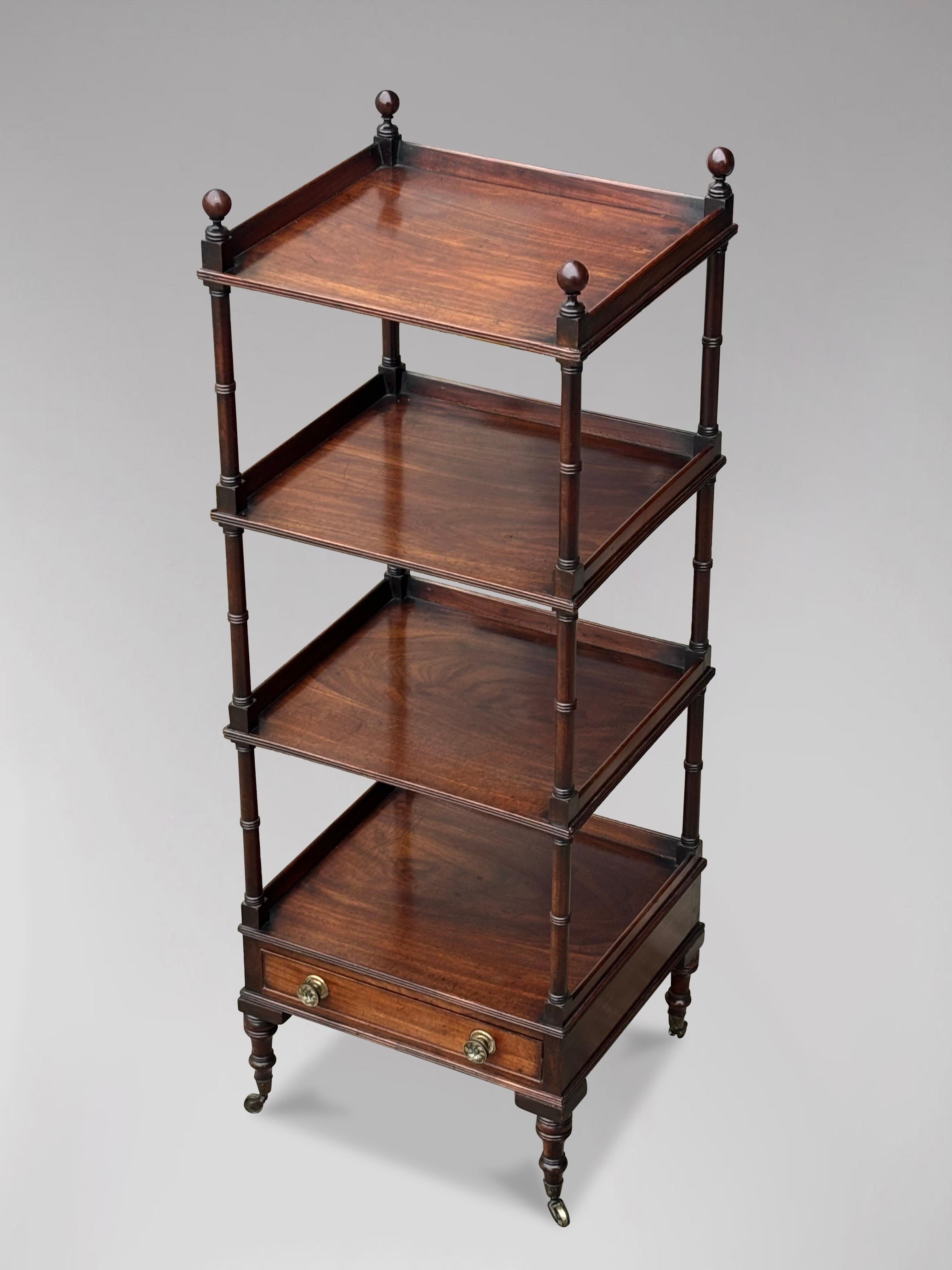 A fine quality early 19th century, Regency period mahogany whatnot. The rectangular top with a three-quarter gallery above four similar tiers, all in quality flame mahogany, over a cockbeaded drawer with turned brass knob handles, supported by