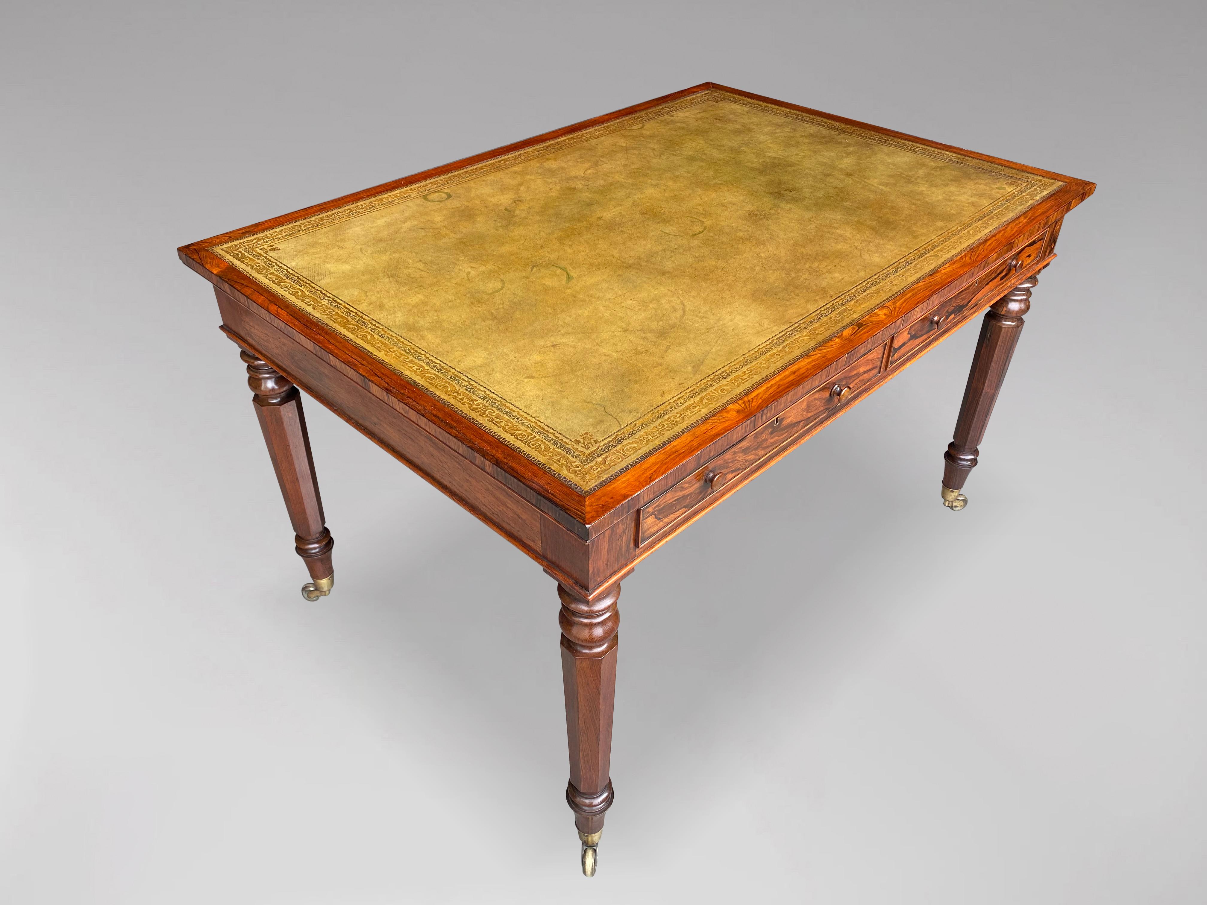 An exceptional quality, early 19th century, Regency period rosewood partners library writing table. The moulded rectangular top with a superb quality and original light green tooled leather inset top above 4 drawers with turned rosewood knobs,