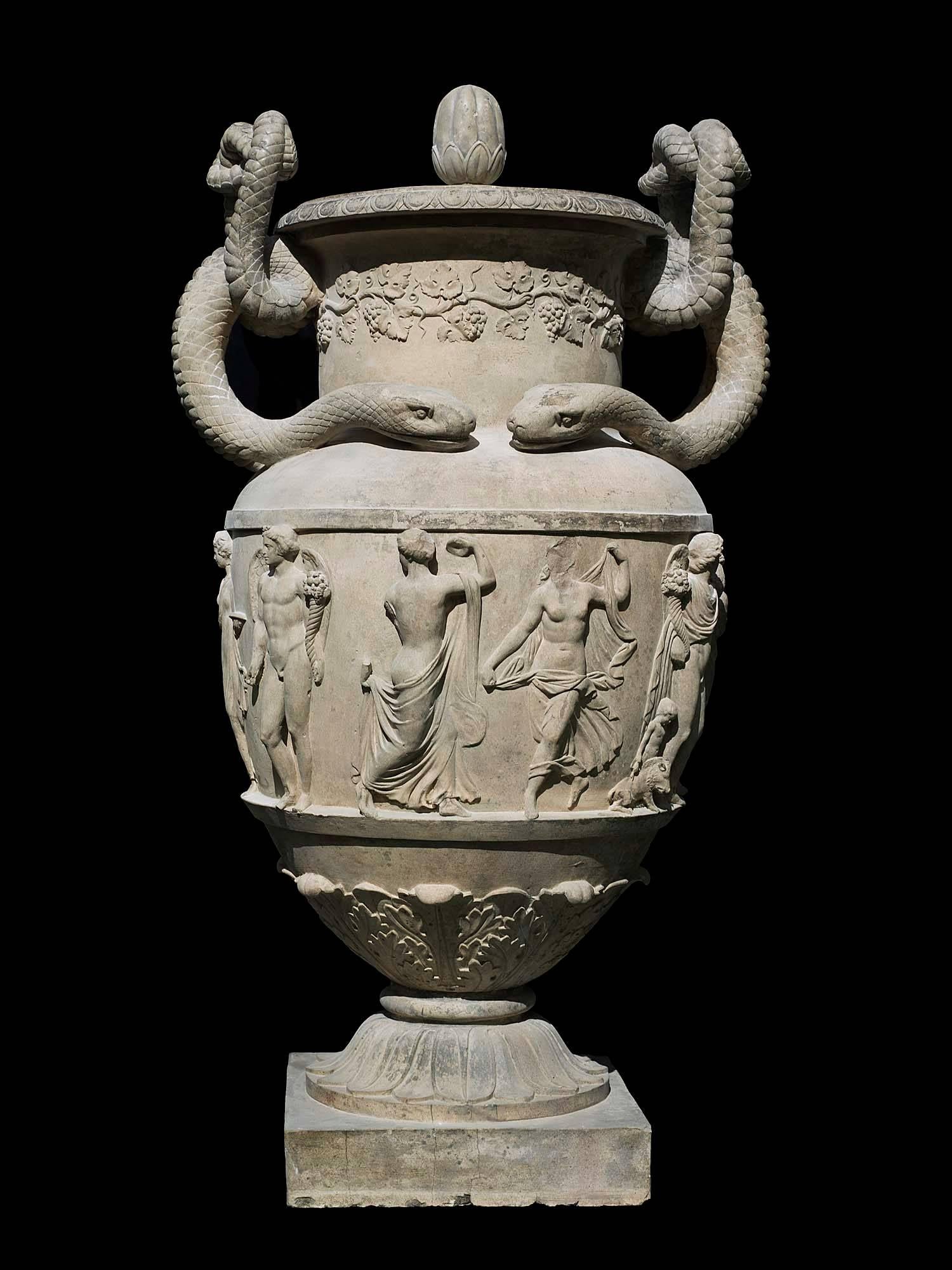 A monumental Regency stoneware urn, in the manner of the antique. This magnificent urn recalls the form of an Ancient Greek krater - a large vessel for mixing wine. The entire urn is dedicated to the God of Wine Bacchus (Dionysus), with a band of