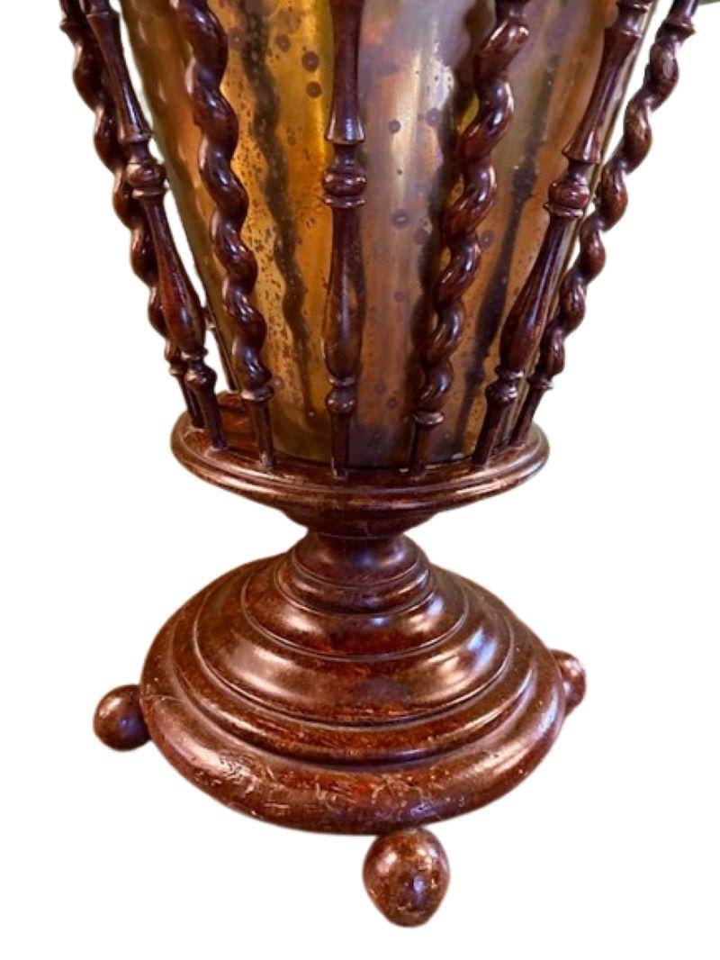 19th Century Regency Style Burl Wood Wine Cellarette, circa 1880, a round stand with burl wood rim and carved delicate baluster turned and barley twist spindles, holding a hand crafted brass liner, on discoid base raised on four ball feet. Such