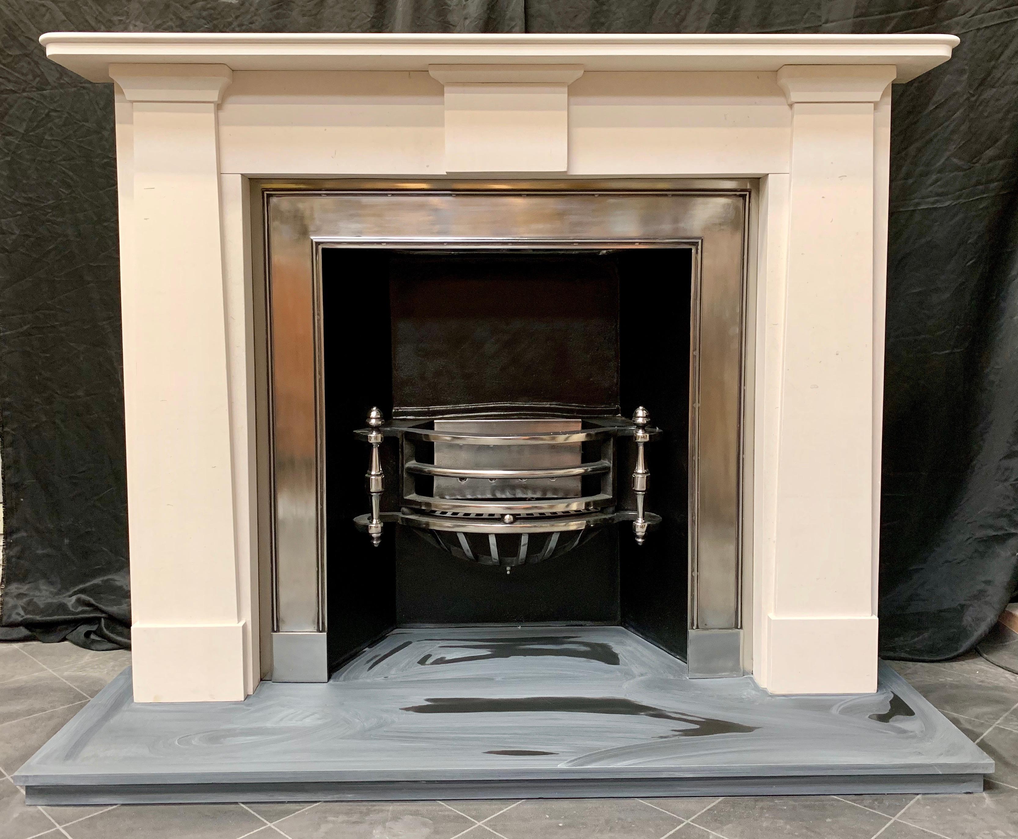 A large and elegant 19th century Regency style Grecian white limestone fireplace surround in the manor of Thomas Hope 1769-1831. A generous shelf with a stepped single bullnose moulding with rounded outer corners, sits above a plain frieze with a