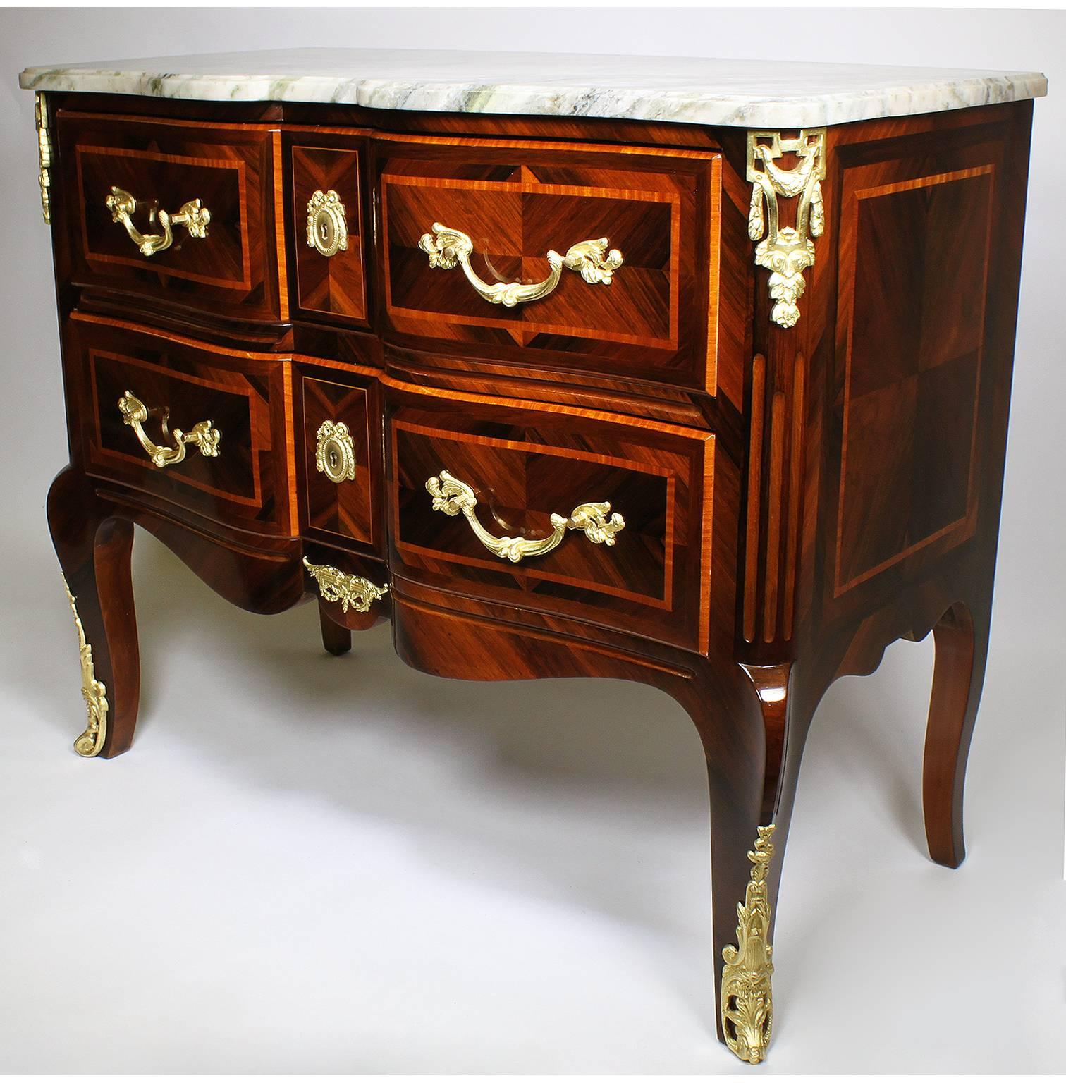 A fine French 19th century Regency transition style kingwood and tulipwood parquetry and ormolu-mounted two-drawer commode with marble top, Paris, circa 1890.

Measures: Height 34 1/4 inches (87 cm)
Depth 20 3/8 inches (51.8 cm)
Length 40 5/8 inches