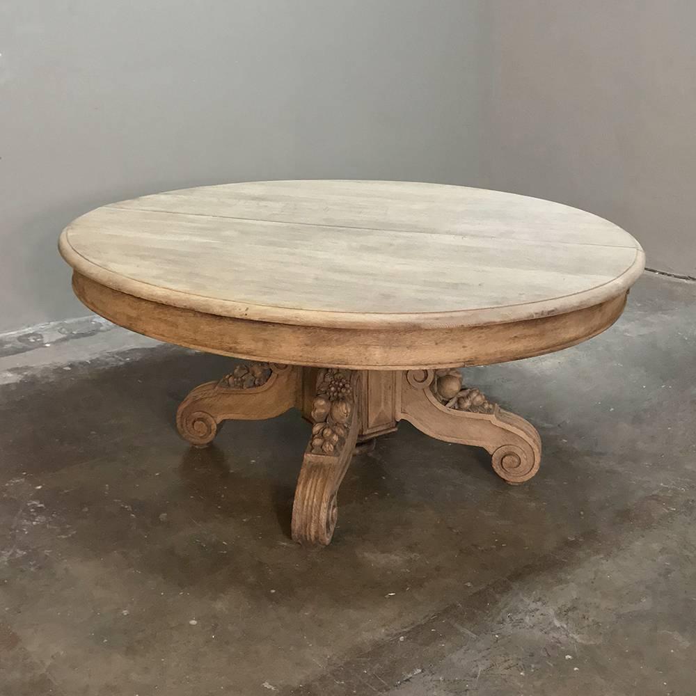 This 19th Century French Renaissance oval pedestal table is only 22 inches tall, making it perfect as a coffee table or low center table. Handcrafted from dense, old-growth European oak, it features a simplistic oval top in stark contrast with the