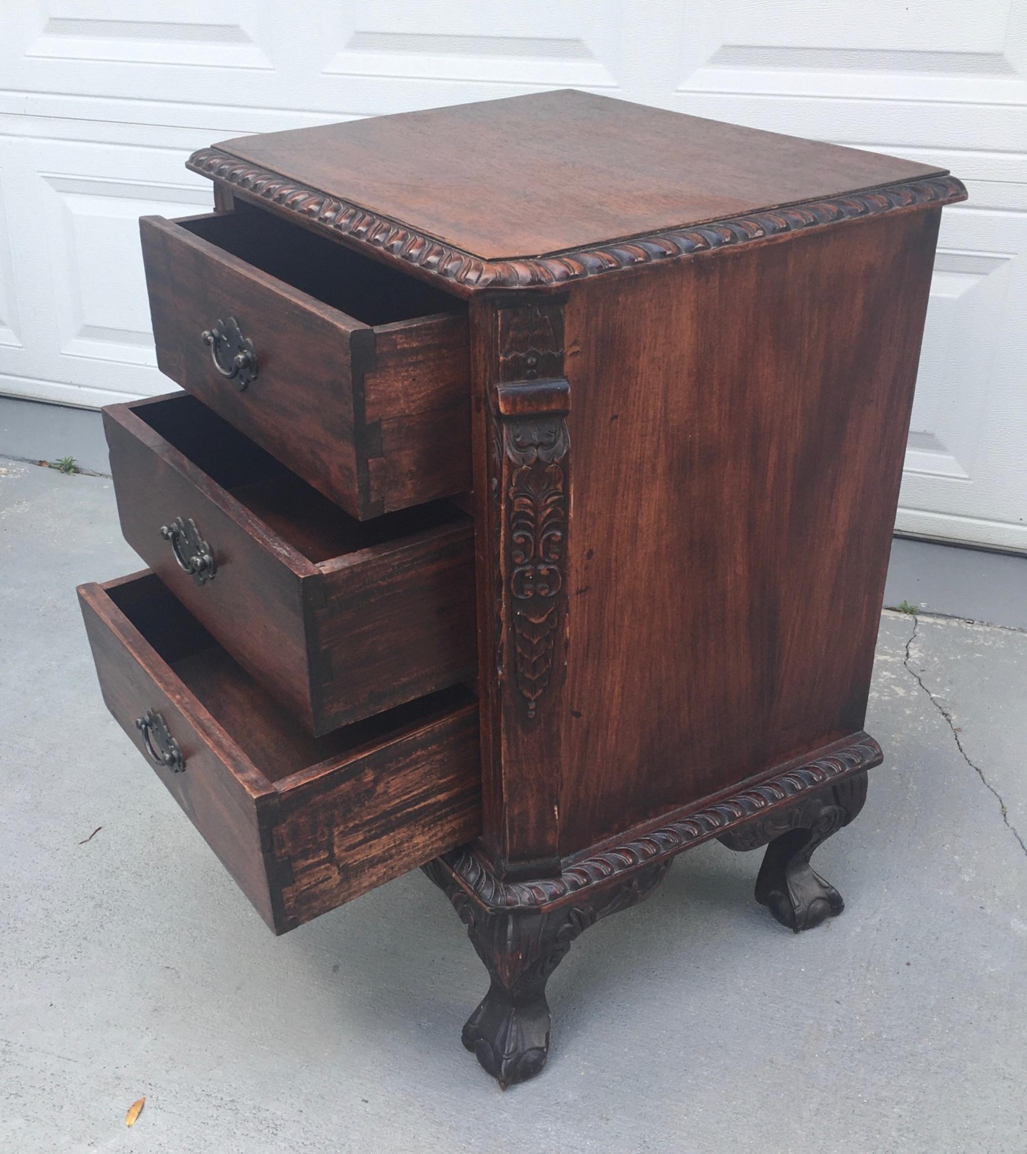 19th century Renaissance Revival carved mahogany three drawer night stand.

This Renaissance Revival night stand has a cornice and apron with dimensional egg and dart decoration. The antique chest has three drawers with bronzed metal handles and a