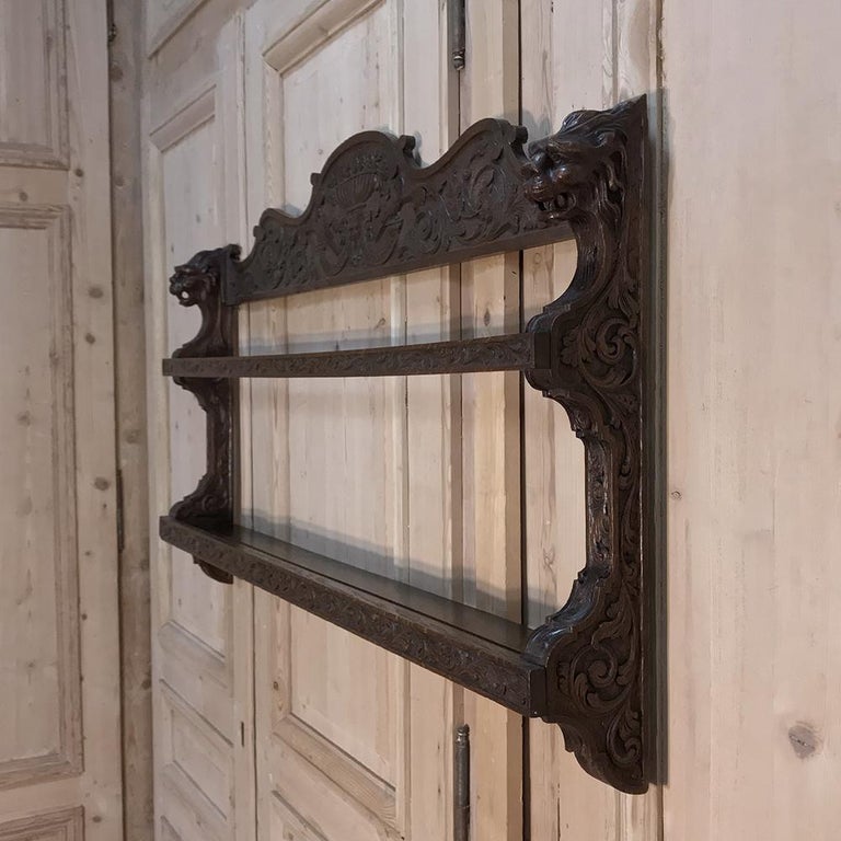 Hand carved to perfection from dense, old-growth white oak in the manner of the Renaissance Revival, this Antique Wall Shelf features elaborate foliate motifs and an urn bursting with fruit overlooking the entire affair. Ideal for displaying your