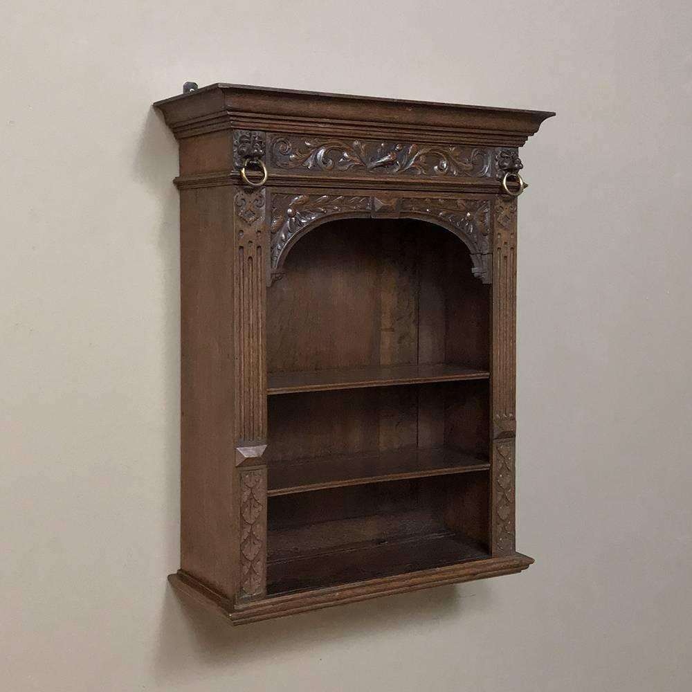19th century Renaissance Revival Dutch wall shelf is the perfect way to display your special collection, without taking up any floor space at all! Finely hand-carved with timeless motifs including lions' heads, it will set off your prized