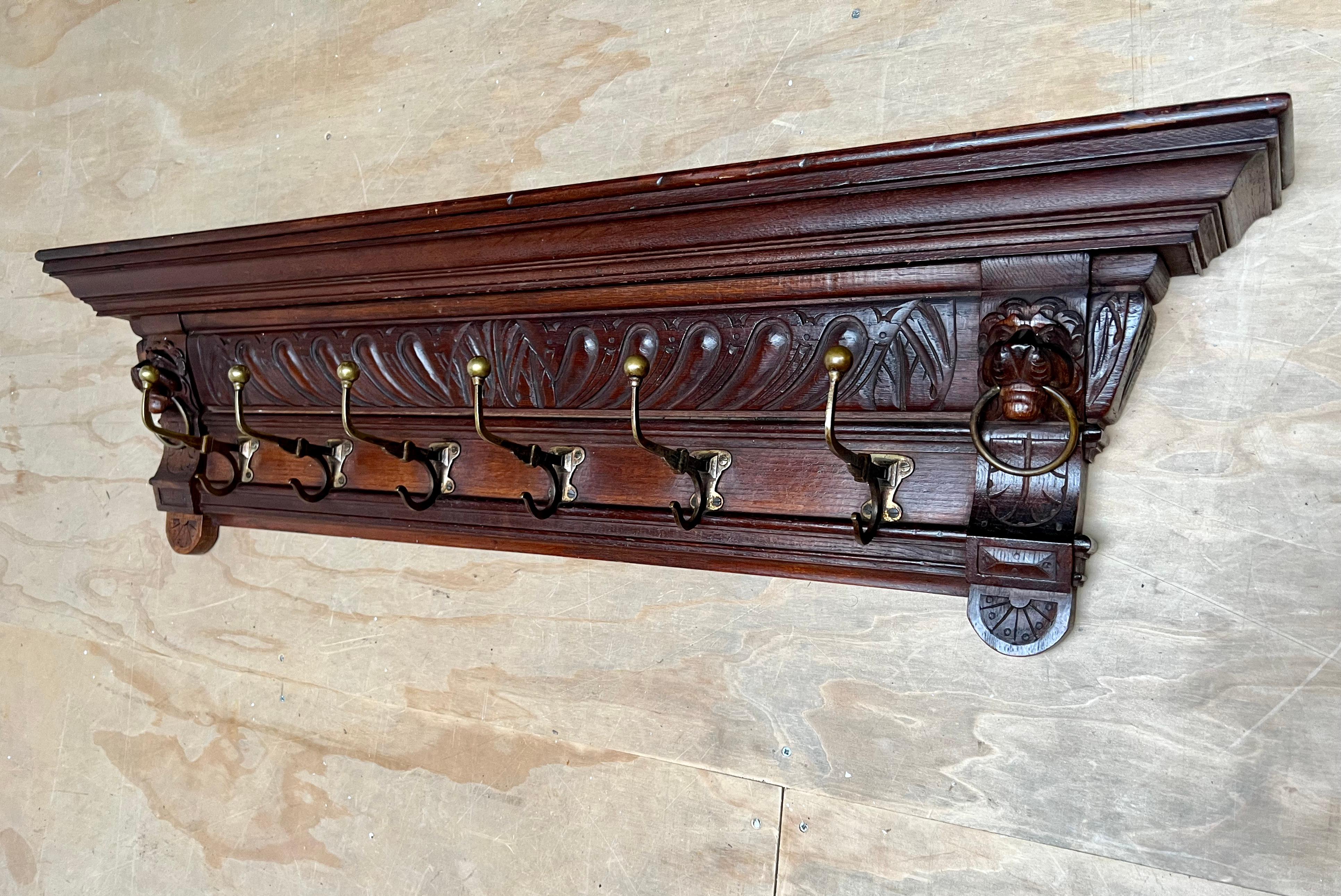 Very well sculptural coat rack with stylish and sturdy bronze hooks.

This antique and practical size antique Dutch coat rack is special and desirable for a number of reasons. First of all, it is very well carved and with great depth. Secondly, this
