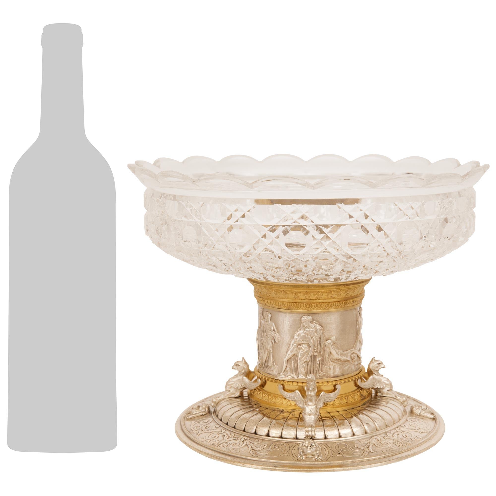 A handsome and most decorative French 19th century Renaissance st. Silvered Bronze, Ormolu and Crystal centerpiece. This stunning centerpiece is raised by a circular Silvered Bronze base with embossed foliate scrolled bands and palmette designs.