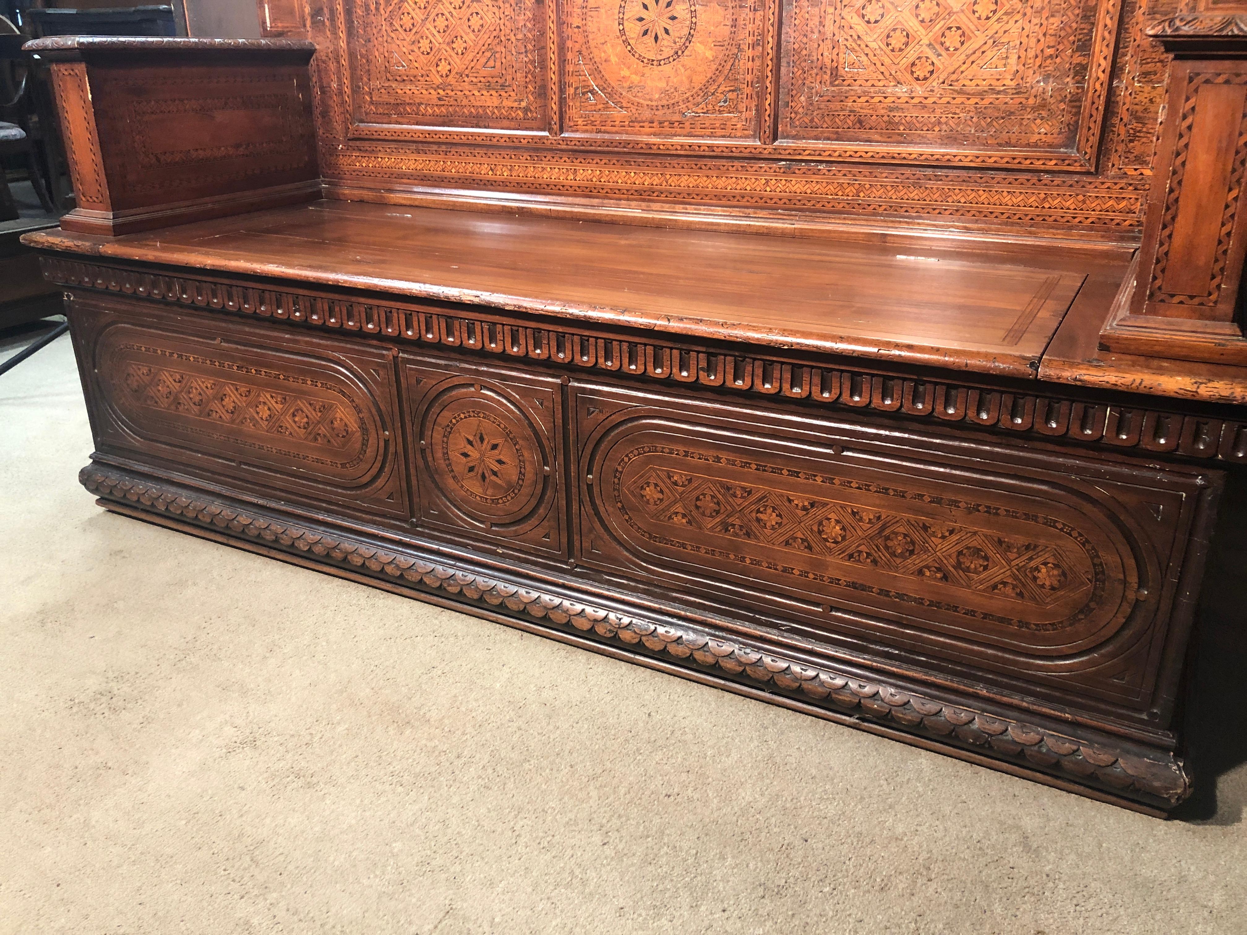 Inlay benches, in every corner and surface possible! Incredible example of Italian inlay, with geometric motifs. The benches is Tuscan, late 19th century, in walnut and inlaid with polychrome woods. Small lack of inlay, small breakages.
To be