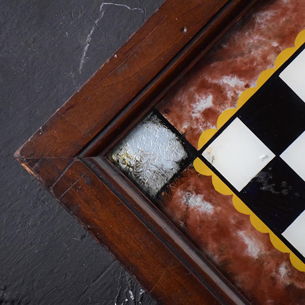 19th century reverse painted game board 

We are proud to offer a delightful untouched example of a 19th Century reverse hand painted glass games board. Still present in its original pine case, these now highly decorative items were once ever