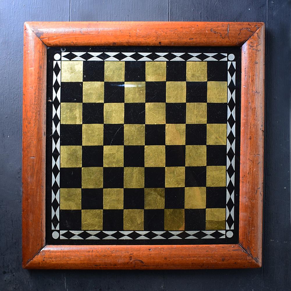 19th Century reverse painted glass games board 

We share what we love, and we love the decorative nature of this stunning English 19th Century reverse painted glass games board. With aged surface across the glass reflection and wooden frame. With