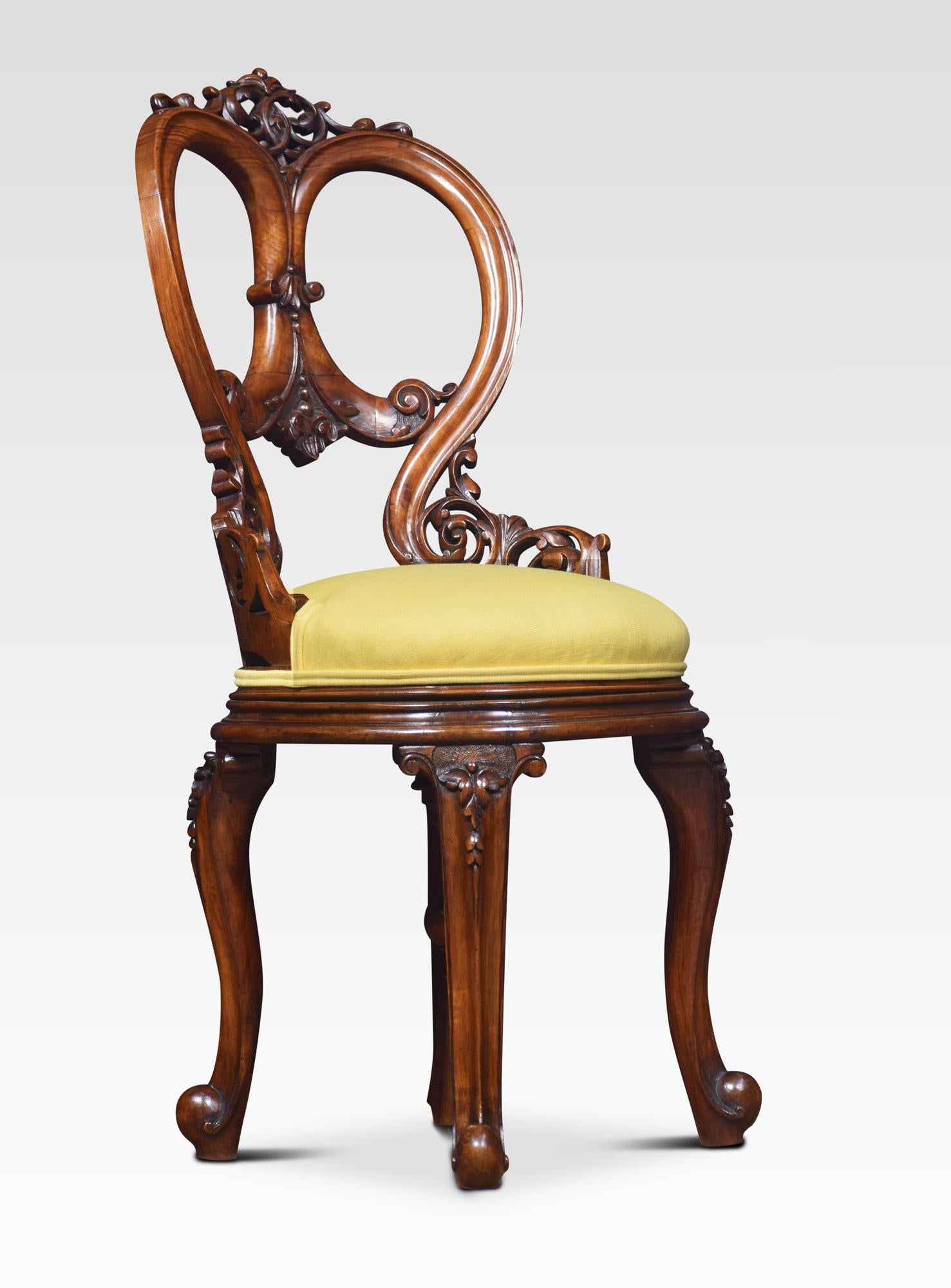 19th century adjustable walnut music chair having balloon carved back above a circular upholstered seat, with swivel height adjustable mechanism. All raised up on four cabriole legs terminating is scrolling toes
Dimensions:
Height 37.5 inches