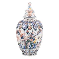 19th Century Ribbed Polychrome Delft Urn with Lid Featuring Lion Finial