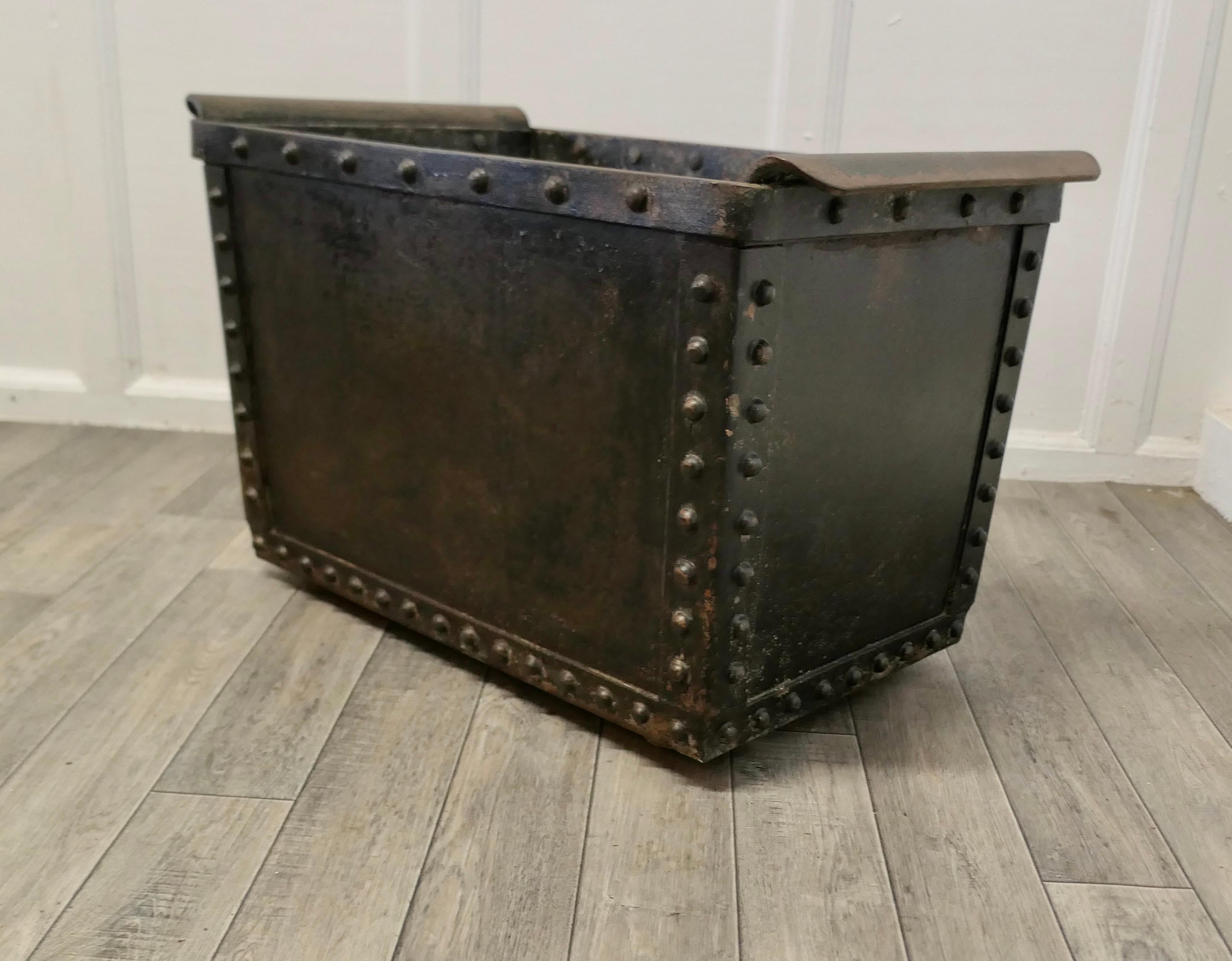 19th century Riveted Quencher, log box, planter.

A great looking piece which is riveted with a reinforce X base and disk feet
The tank is galvanised with sloping sides and full length iron strap handles at each side
The tank has had holes