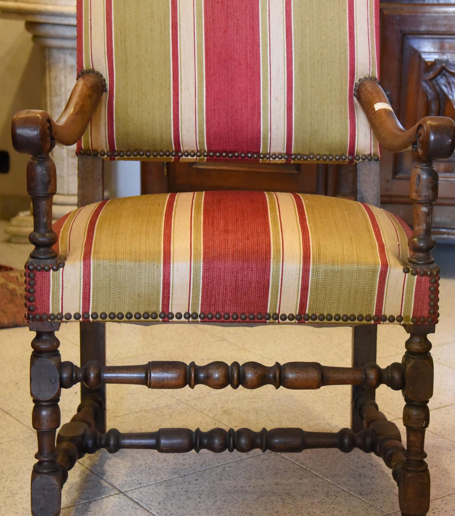 aRocchetto style armchair of the 600 style, made in the early 800s, in dark Walnut, with Studded spring Padding, elegant striped Fabric, wide and very comfortable seat.
Hand carved. Italy.