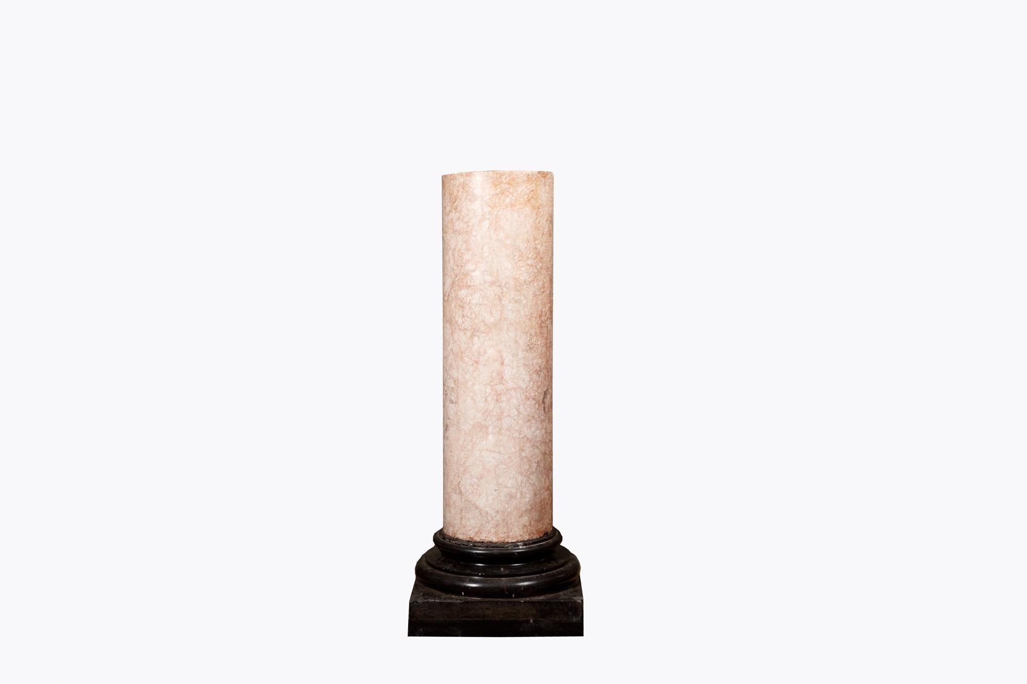 19th Century Rosé Boréal pillar in the form of a classical column. The solid cylindrical barrel, in a blush coloured Rosé Boréal stone rests on a squared base of black marble.