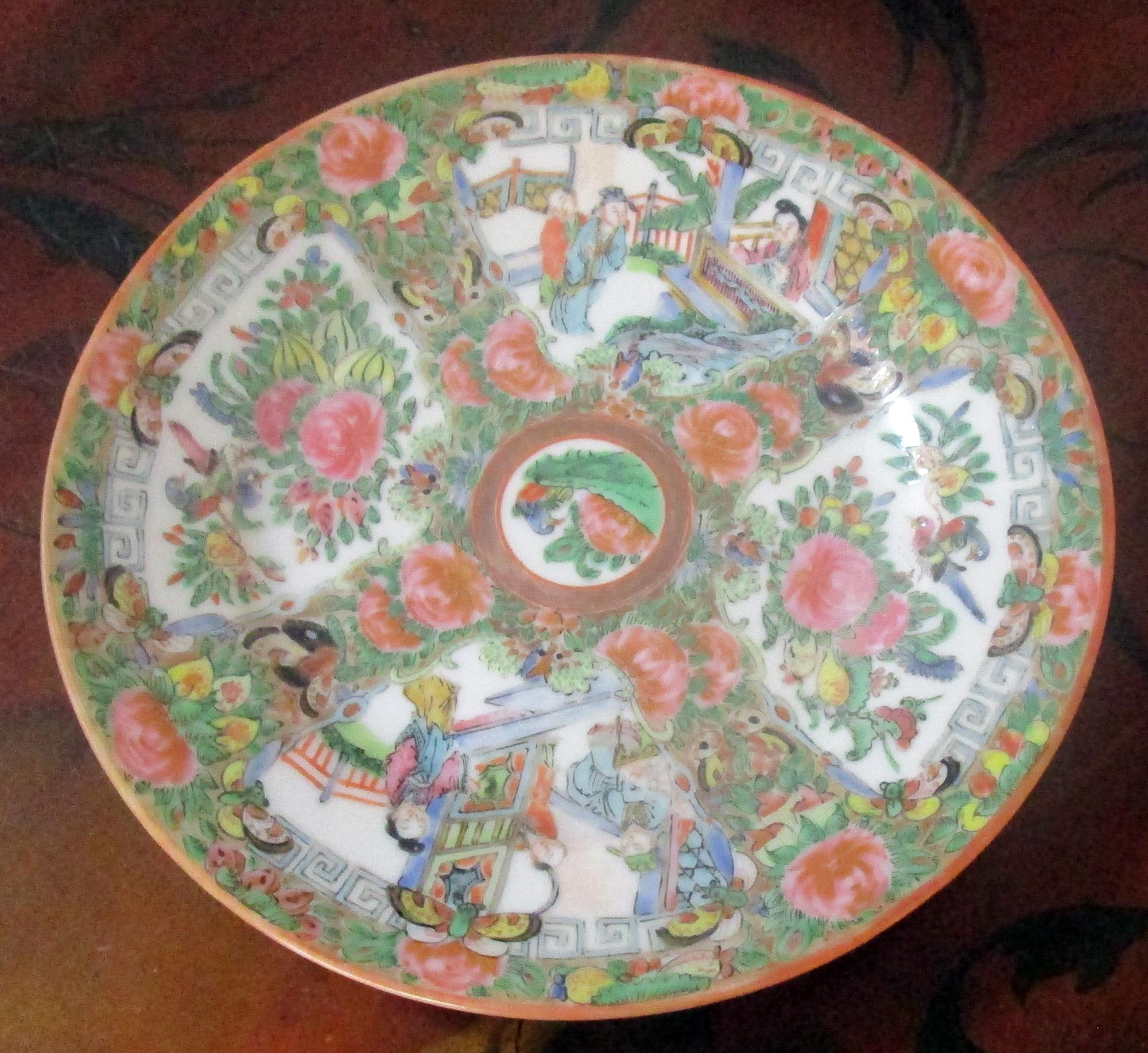 Set of four Chinese export late Qing period rose medallion dessert plates featuring traditional medallion design with figures in scenes, floral and bird panels. Pink rose central medallion. Greek key pattern border on three of the plates.
See