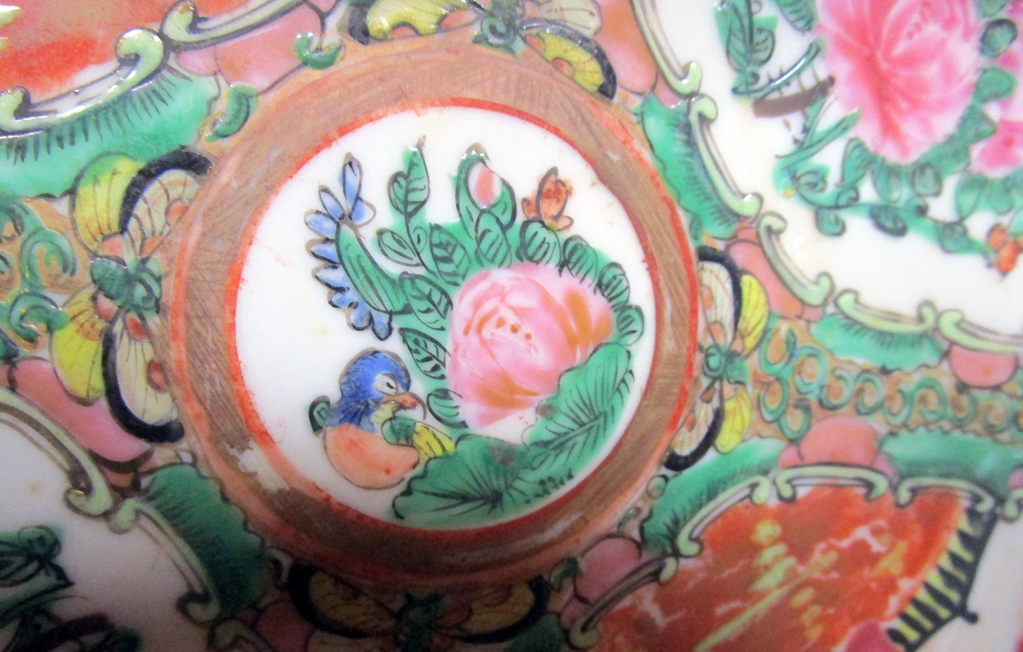 Set of four Chinese export late Qing period rose medallion dinner plates featuring traditional medallion design with figures in scenes, floral and bird panels. The pink rose and bird center medallions vary- see image closeups. Please note that the