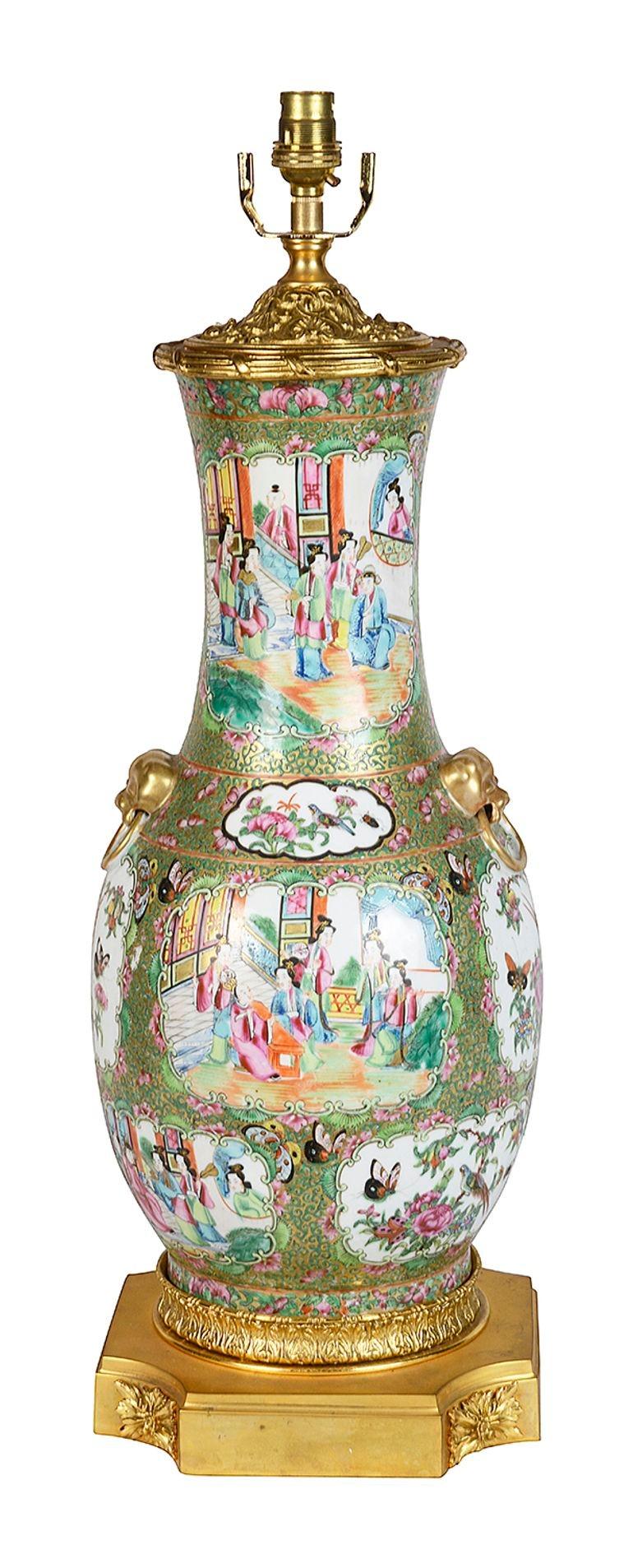 A very good quality 19th Century Chinese Rose medallion vase / lamp. Having classical inset hand painted panels depicting classical scenes of various courtier, the ground in the typical green foliate decoration. Ormolu mounts to the lid and plinth