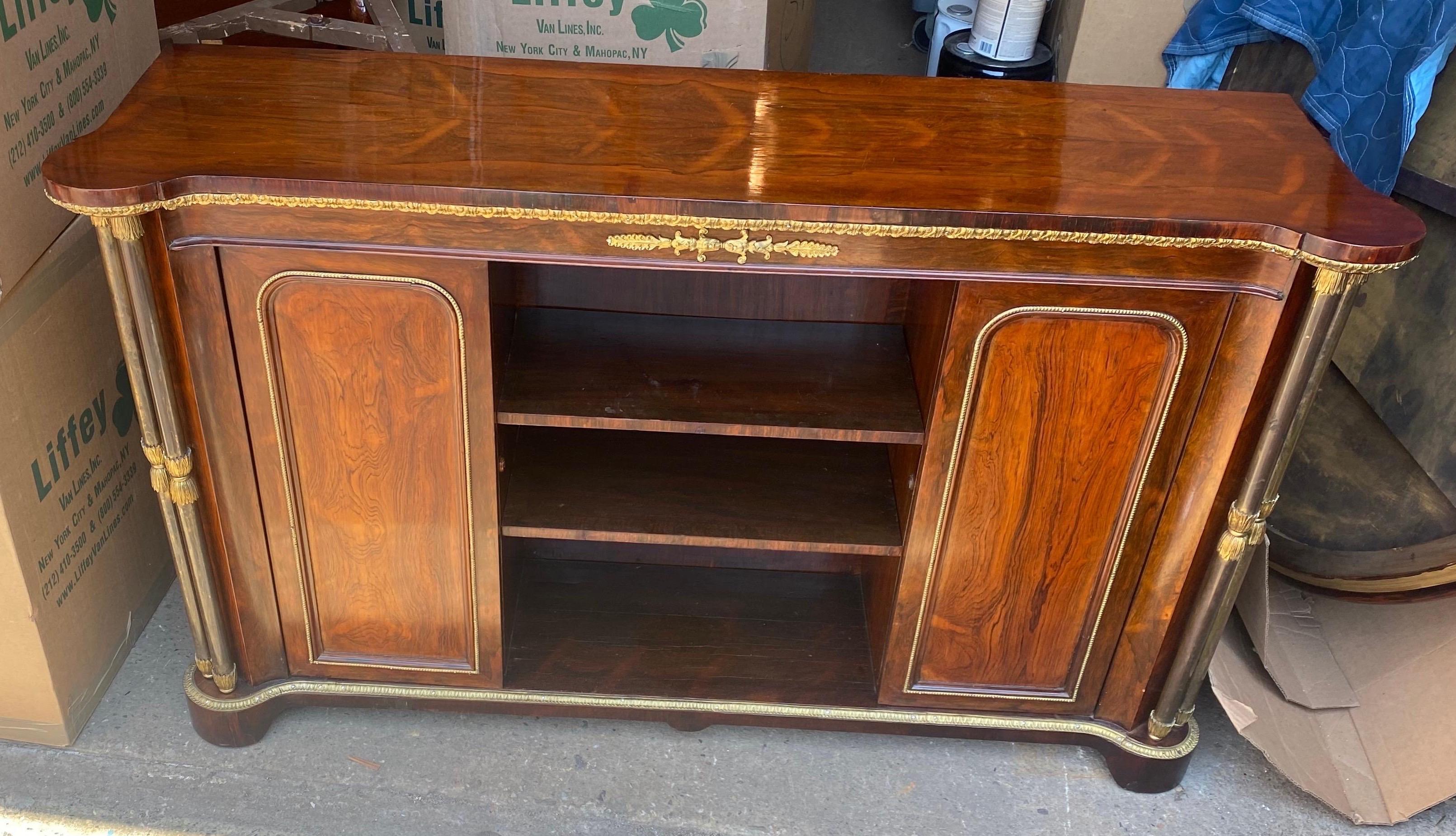 19th century rosewood and steel English Regency bookcase or cabinet. Great color and patina. Bronze mounts, steel columns. Cabinet doors open to reveal more shelves.