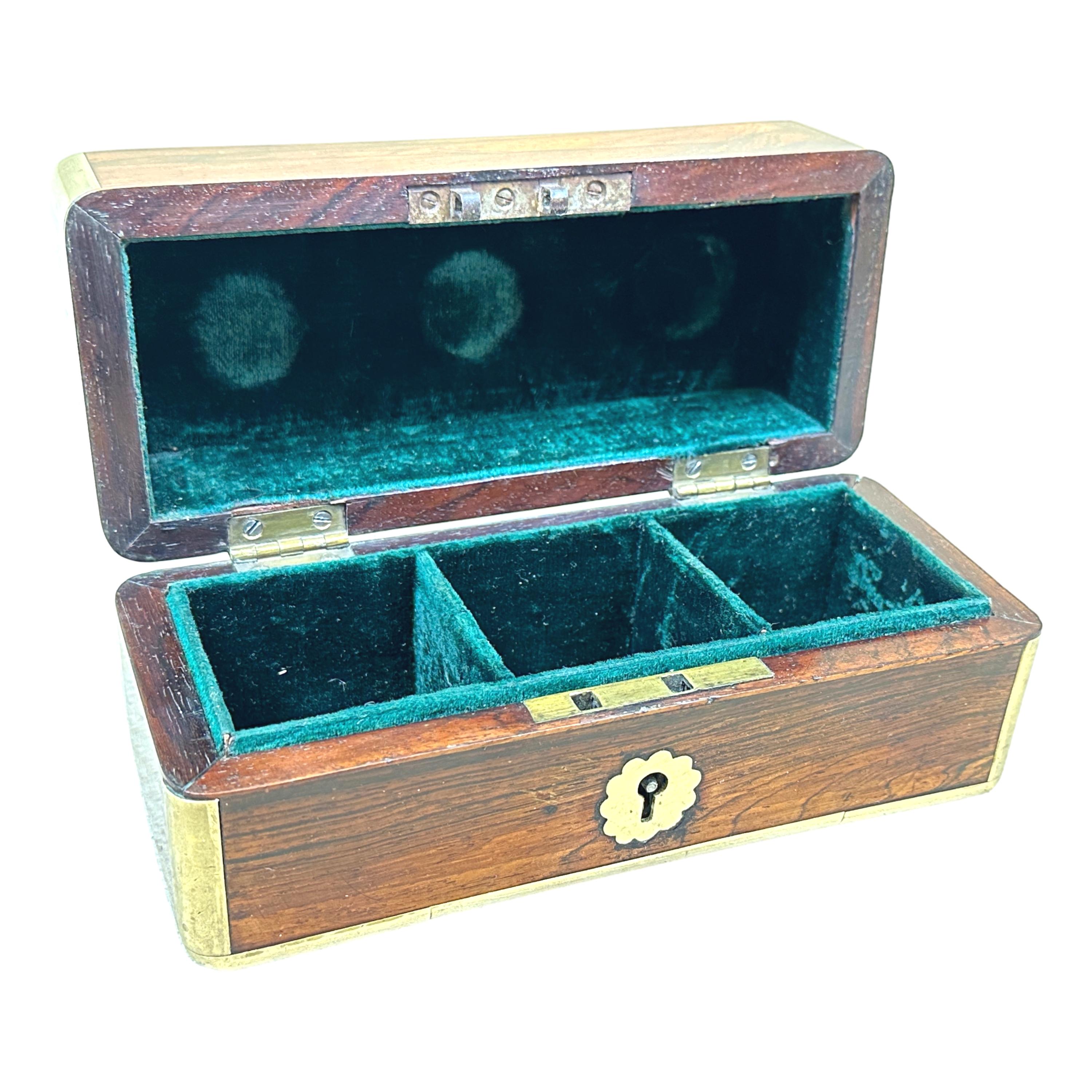 A charming and particularly good quality mid-19th century, Victorian Period, rosewood perfume scent box, with attractive brass bound decoration and hinged lid, enclosing three original glass bottles (2 damaged).


This charming little vanity box