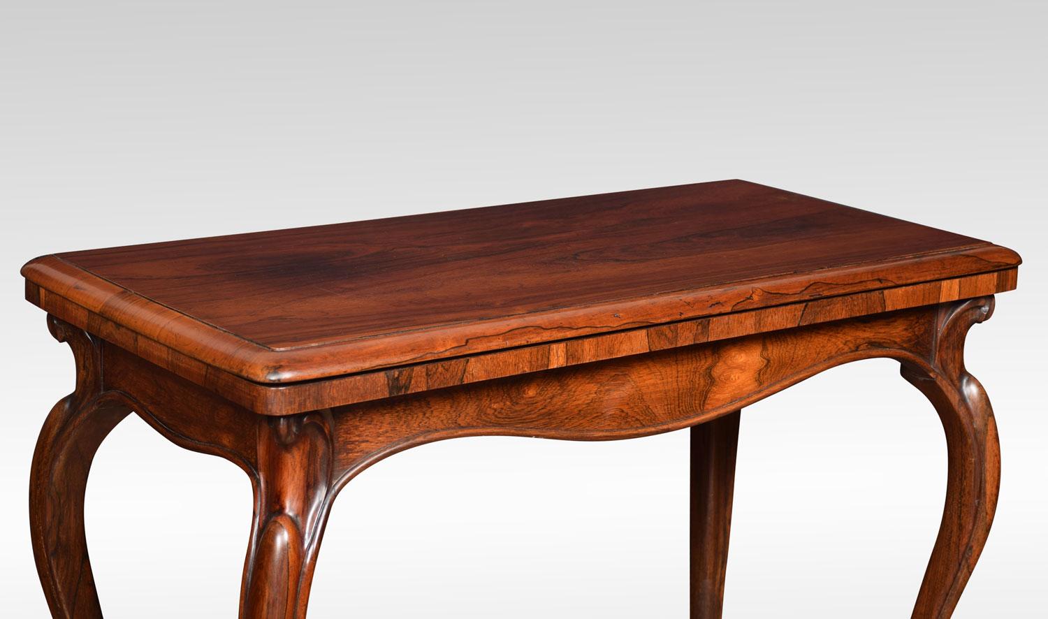 Rosewood card table, the rectangular top with rounded corners opening to opening to reveal inset circular baize playing surface. All raised upon four slender cabriole supports terminating in scroll feet and original castors.
Measures: height 30