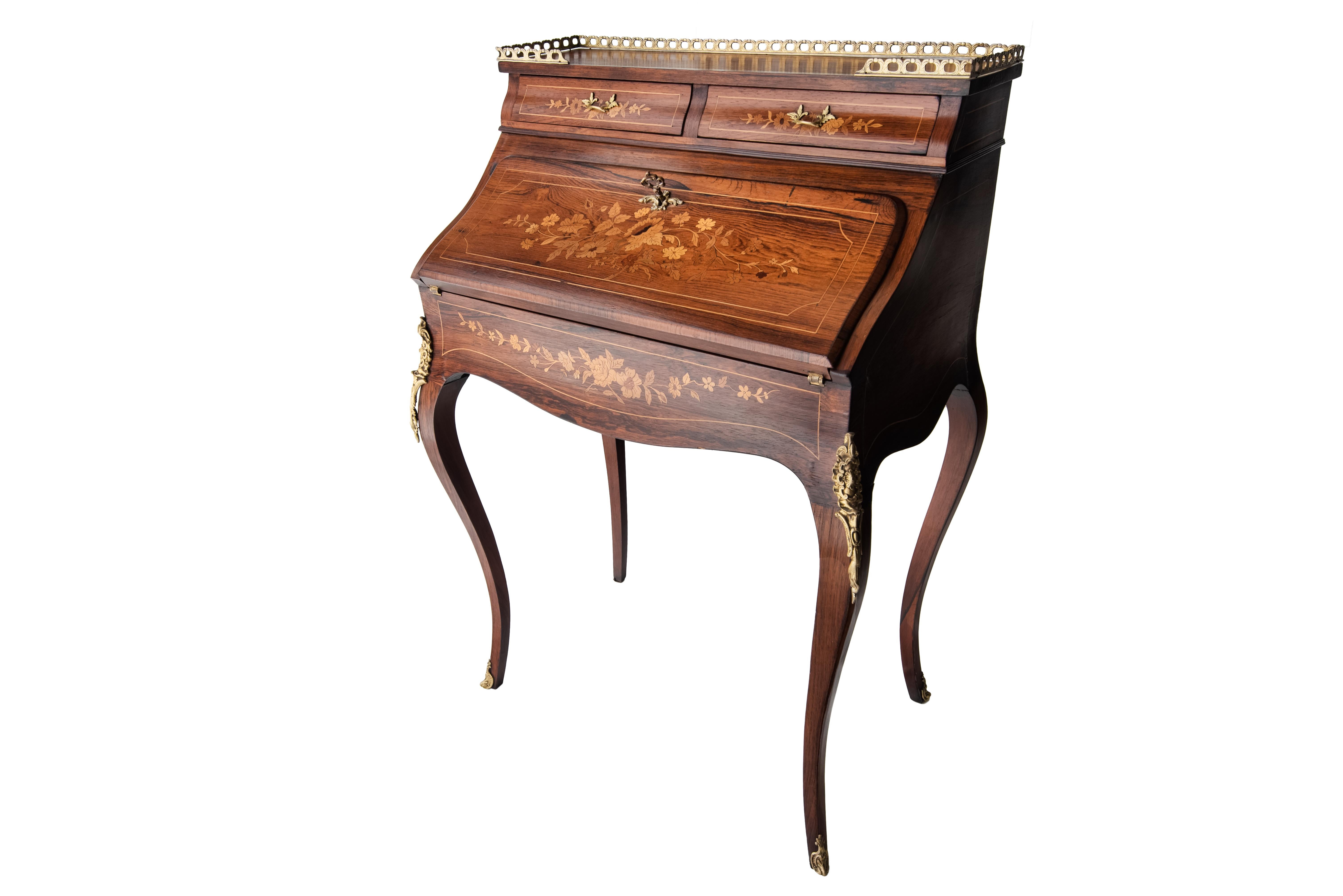 19th century rosewood French Louis XV style marquetry bureau desk with secret compartment, circa 1870.
It is decorated throughout with beautiful floral marquetry and the of the cylinder has a stunning marquetry panel. It has a beautiful top with a