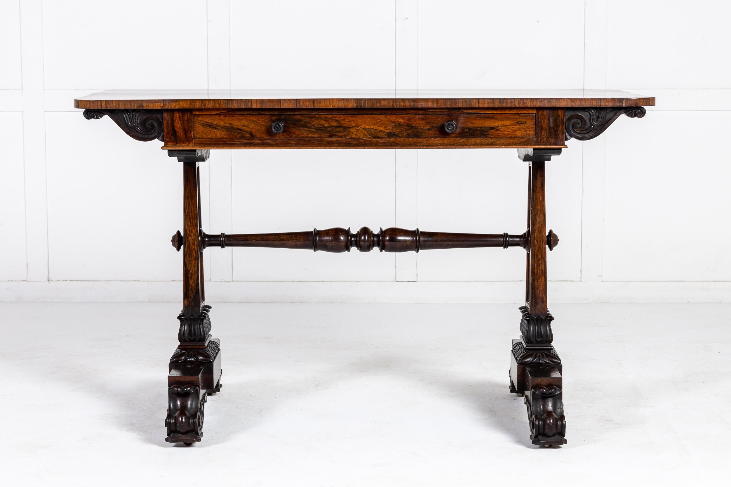 A super, good quality 19th century rosewood writing/library table, beautifully finished all round, making it a freestanding table if required. The top of finely figured rosewood has rounded corners supported by two upright end supports, connected