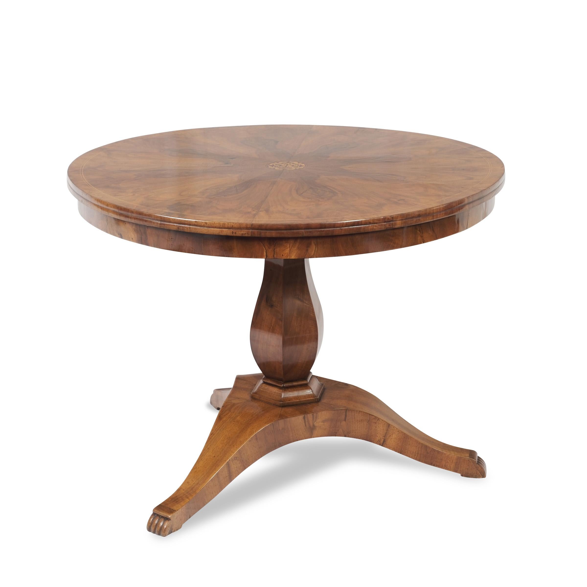 Saloon table, Biedermeier, around 1820/30

walnut veneered, top with star veneer and central decorative inlay, columnar leg with 3-pass foot, paw feet, restored condition, shellac polish

Dimensions: height: 76,5 cm - diameter: 102,5 cm
