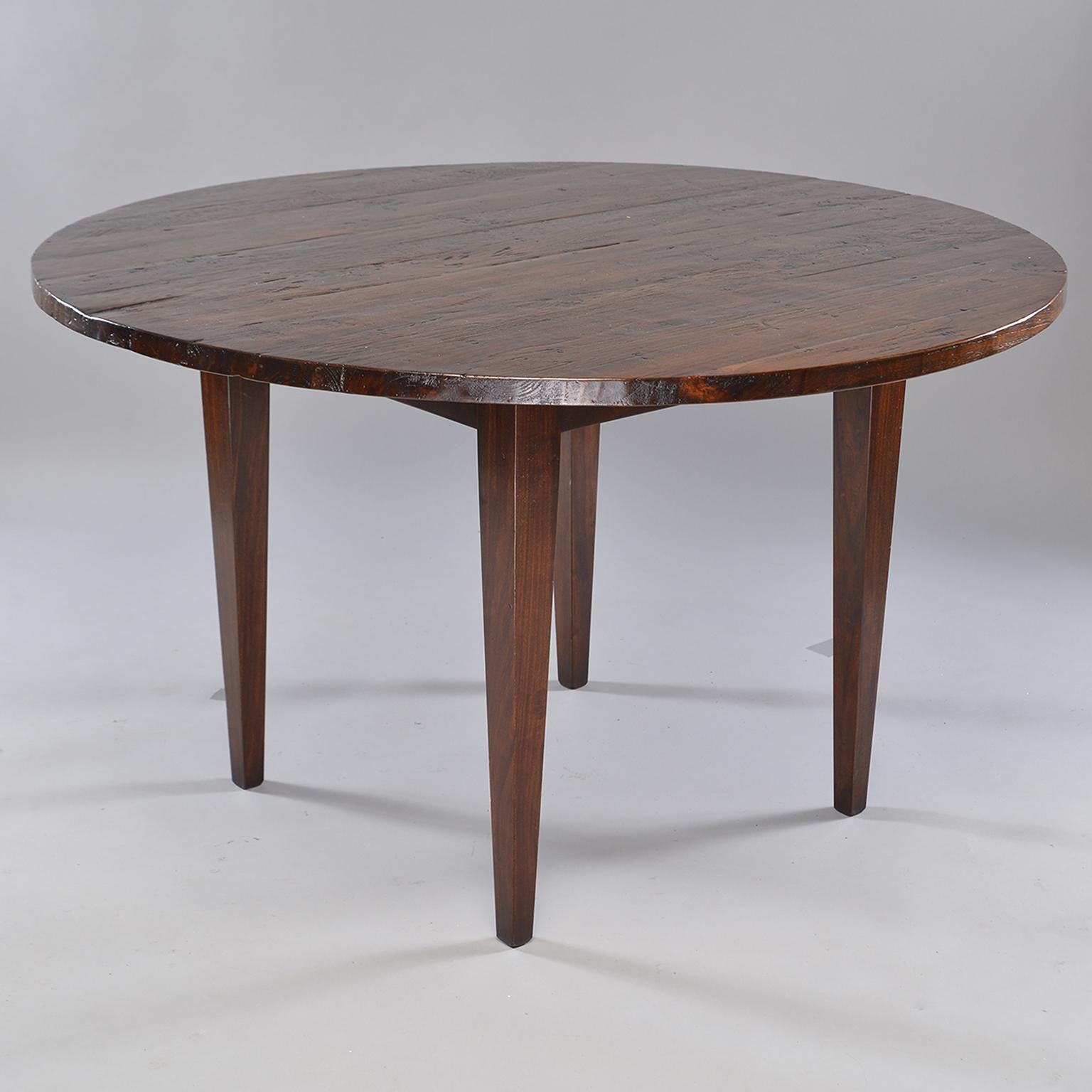Found in England, this round chestnut table top dates from 1880s. Mounted on a new base, this handsome table is perfect for use as a breakfast or smaller dining table.