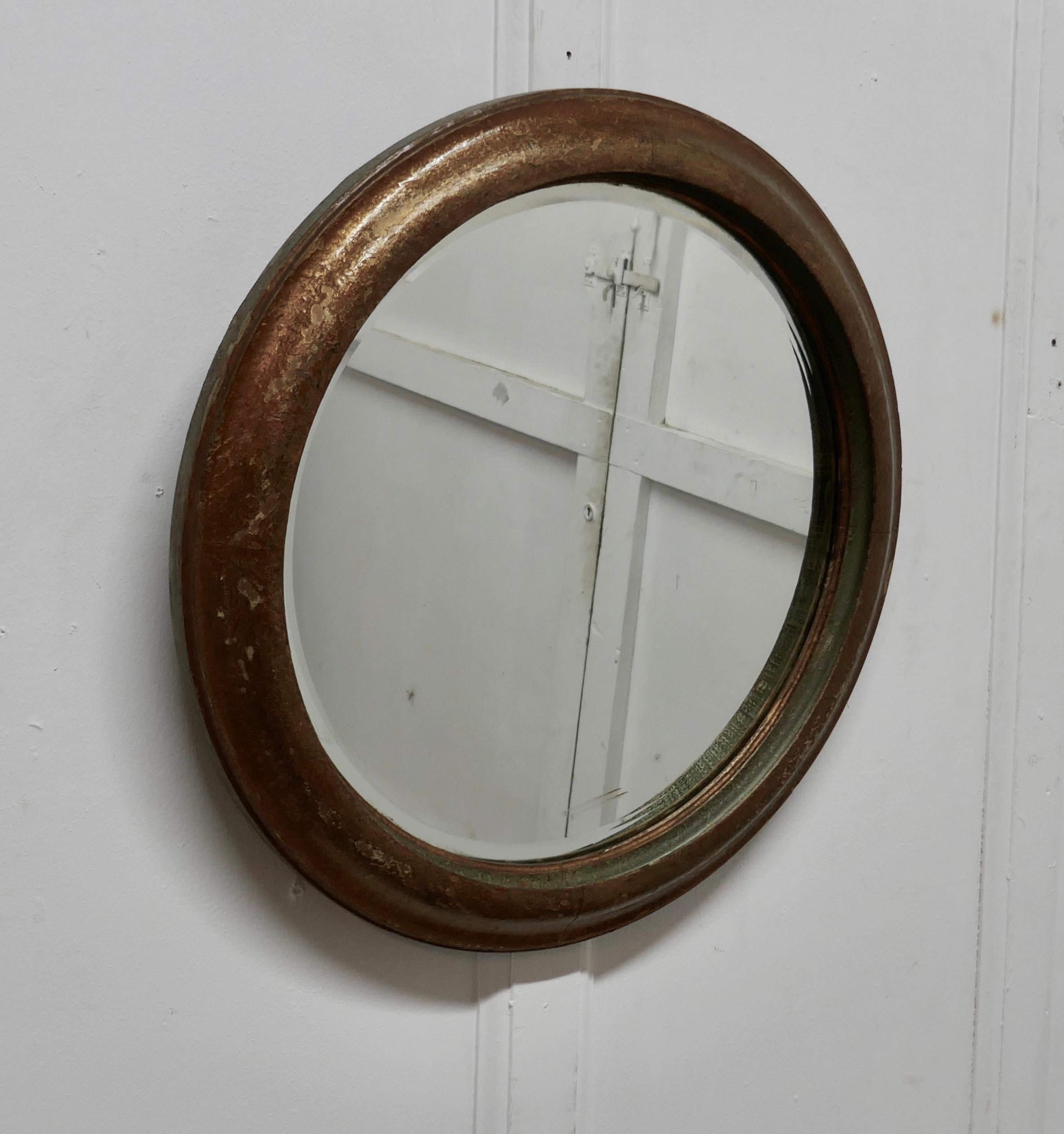 19th century round French wall mirror
 
This is a lovely 19th century French mirror, the 2” moulded frame has a charming crackled gold finish which shows the red and green oxide undercoat showing through, it is sound and has the original bevelled