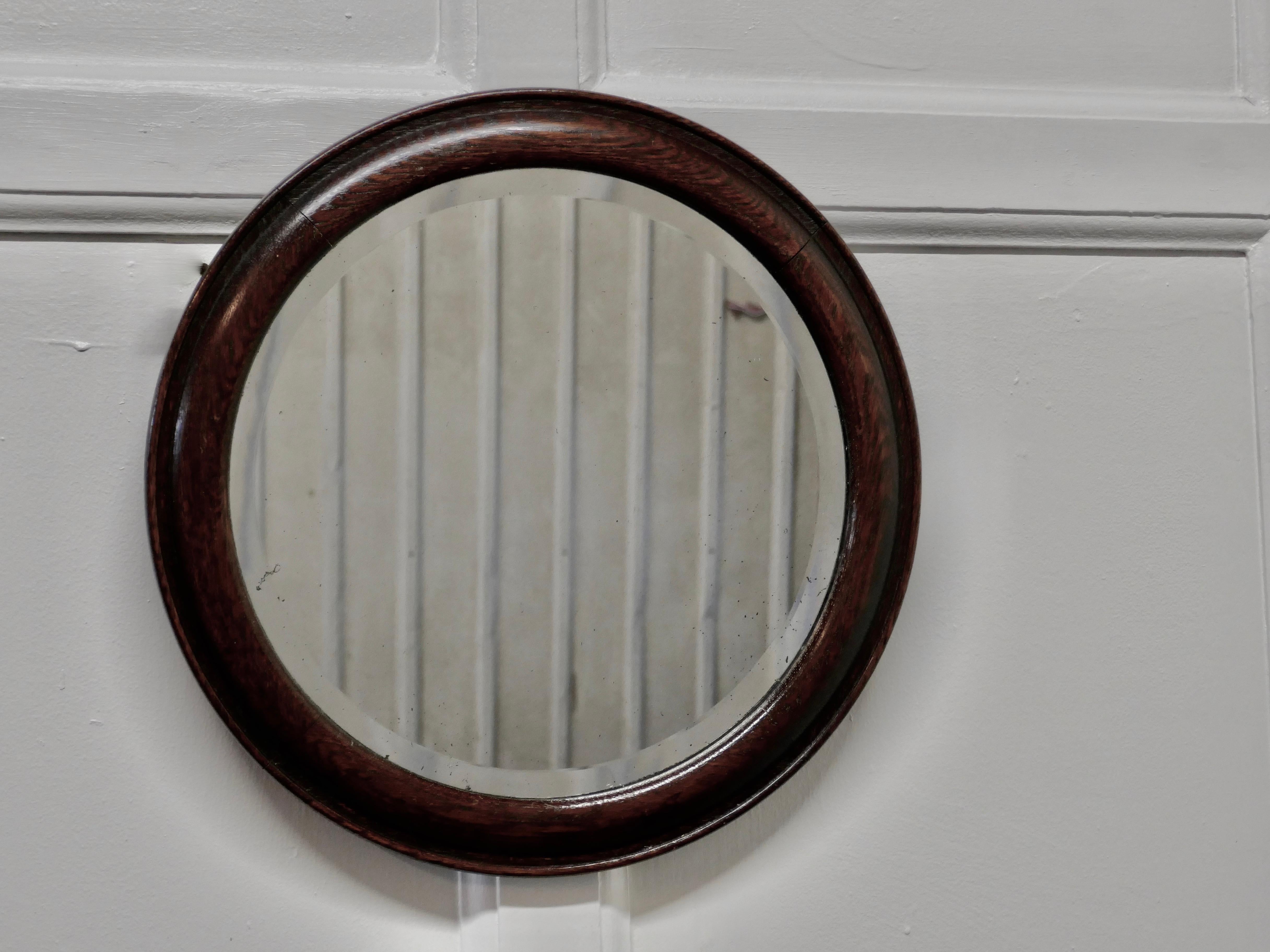 19th century round oak wall mirror

This is a lovely Victorian mirror, the mirror has a 2” moulded oak frame it is in good condition and has the original beveled glass, this has very slight foxing but nothing very noticeable
A lovely decorative